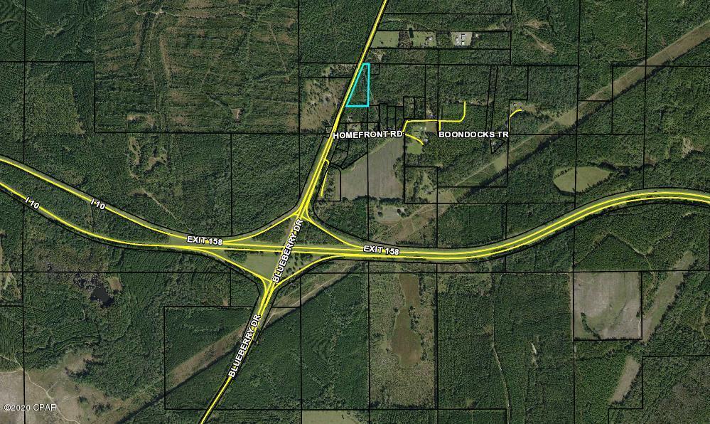 Good location off I-10.  Wooded and ready for the right person or company to develop.  This could be a good future investment.  All along the I-10 corridor is growing. This property is zoned AG2= 1 home per acre, no wetlands, Flood zone x. Power is available for easy connection to the property.  Lots of paved road frontage on State Road 286.  Many possibilities at such a great location.