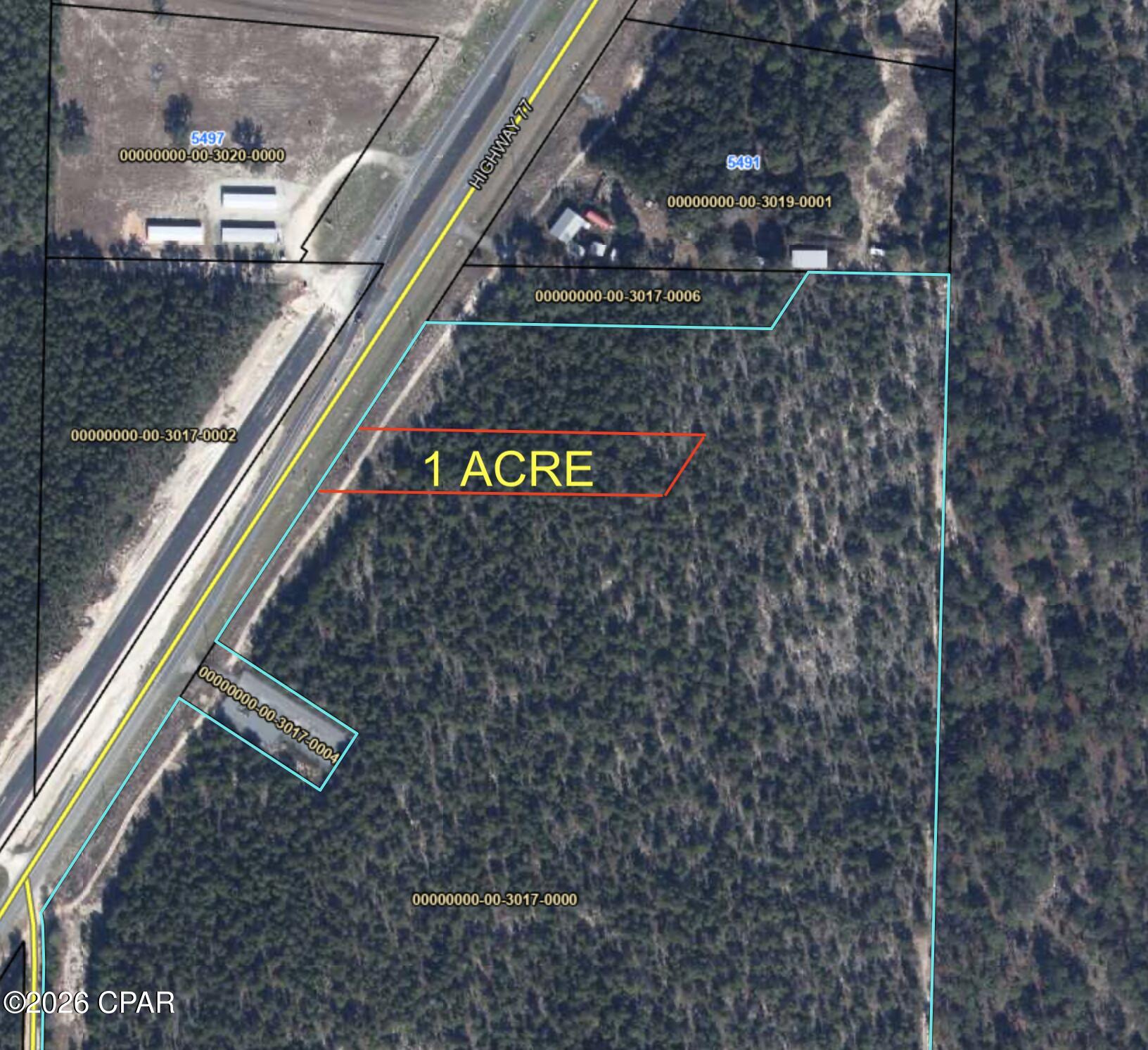 One Acre with 100' of Hwy 77 Frontage, C-3 General Commercial zoning. High and Dry. Great visibility for your business.