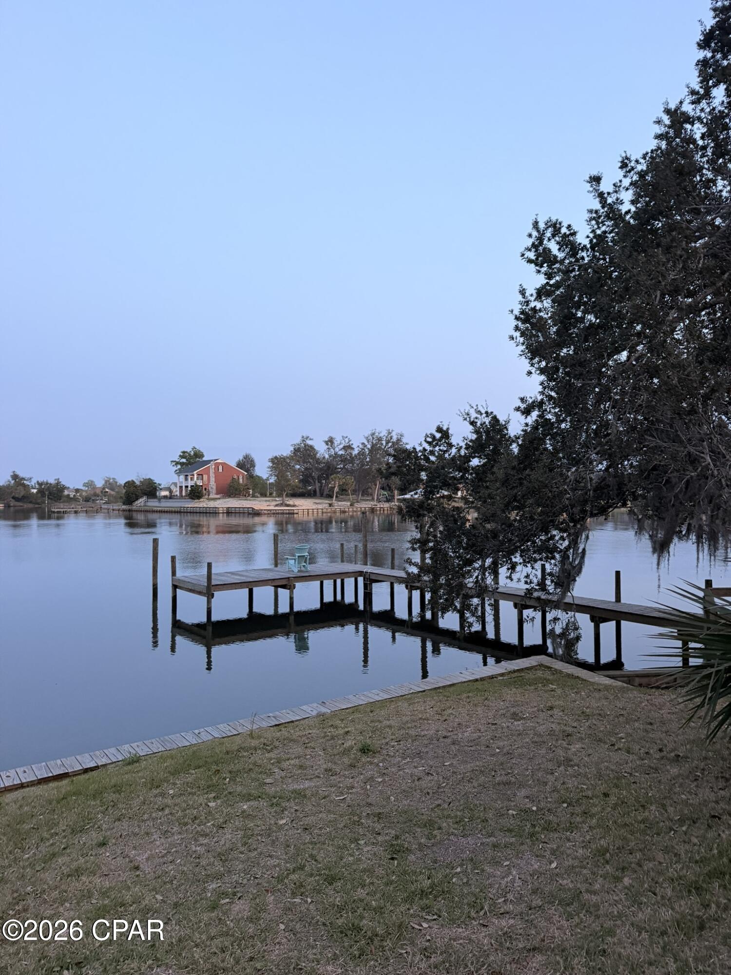 For comp purposes. Waterfront 3Bdr/2.5Bth townhome in the Panama Country Club with fantastic views of Beatty Bayou.  Kitchen opens to living area, fireplace, half bath and master bedroom and bath on first level. Second level hosts two bedrooms and a bath. Home features stainless appliances, new dock, floor to ceiling wood burning fireplace, and oversized garage.