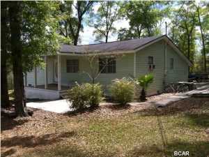 Affordable living in a beautiful county setting. This home is located about 25 minutes from Panama City Beach and about 15 minutes from the new Beaches International Airport. Come get the best of both worlds. Country peaceful living near the worlds most beautiful beaches. This property aside from the 4.17 acres has a 32 x 25 pole barn. Lots of land for all of your out door activities and good times.