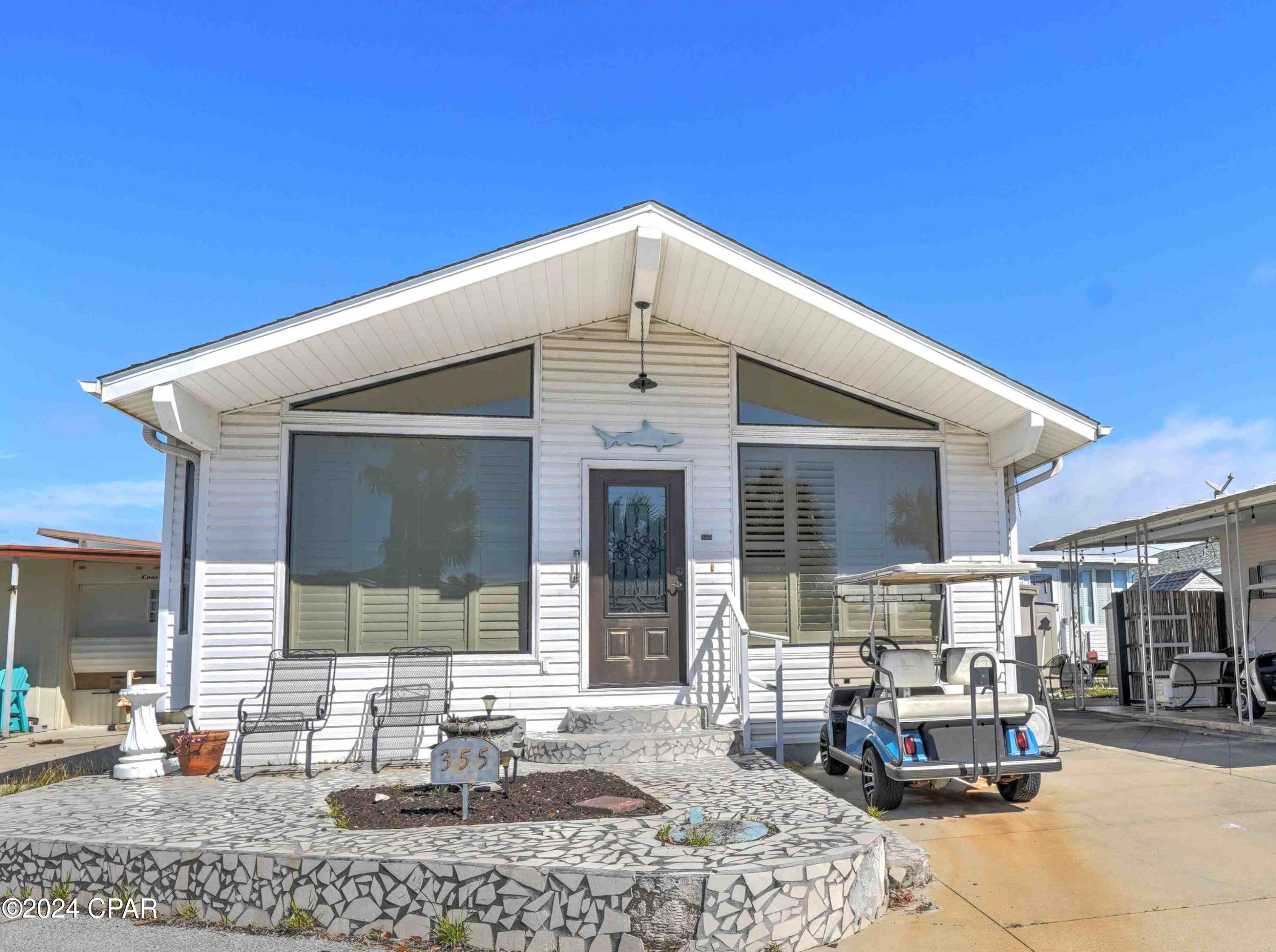 Welcome to Venture Out, one of Panama City Beach's premier gated golf-cart communities! This beautifully maintained 2-bedroom, 2-bath beach home also offers a potential bunk room, making it perfect for vacation rentals, a second home, or full-time coastal living.
Step inside to an inviting open-concept floor plan featuring vaulted ceilings, abundant natural light, and updated wood-look tile flooring throughout the main living areas. The spacious kitchen offers ample cabinet space, updated backsplash, stainless steel appliances, breakfast bar seating, and flows seamlessly into the living and dining areas--perfect for entertaining after a day at the beach.
The home's flexible bonus space provides the perfect setup for additional bunk beds, office space, or extra guest accommodations. Large front windows and coastal-inspired finishes create a bright and airy beach retreat feel throughout the home.
Outside, enjoy low-maintenance coastal living with a spacious driveway, outdoor seating area, and included golf cart for easy access to the beach, pools, and resort amenities.
Located within Venture Out, residents and guests enjoy private beach access to the Gulf of Mexico, two swimming pools, tennis courts, pickleball, shuffleboard, basketball courts, playground, fishing pier, marina, boat ramp, and 24/7 gated security. HOA dues include water, trash pickup, and security.
Whether you're searching for a vacation getaway, investment property, or beach home, this property offers the perfect combination of comfort, location, and resort-style living in the heart of Panama City Beach!