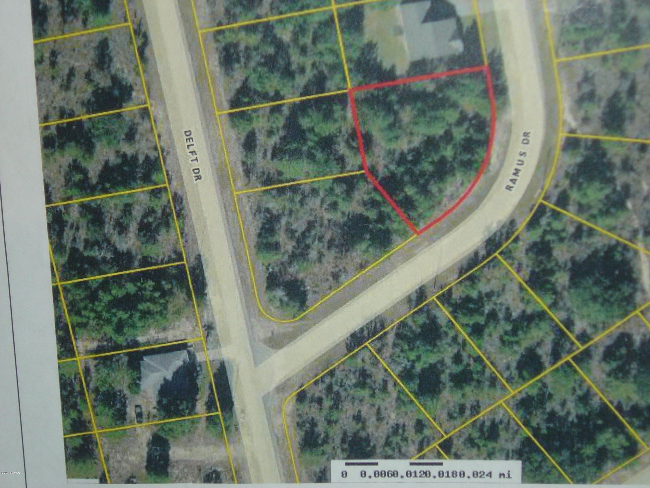 Large lot in a good area for building or investment.  Purchase an additional three lots in Sunny Hills  with the purchase price for all four being $8500.00.