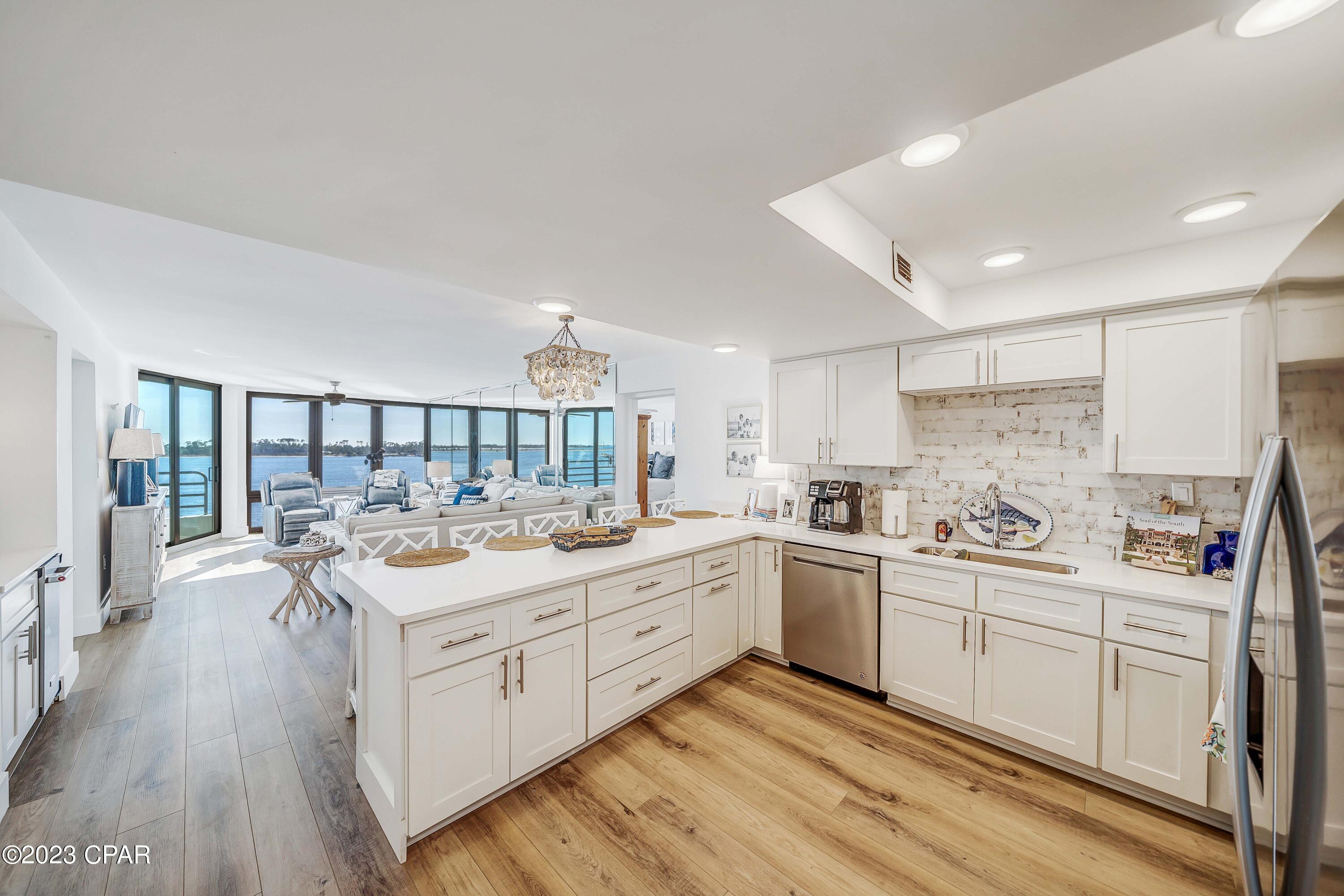 Prepare to be amazed by this beautifully remodeled 5th floor condo at Lagoon Towers in Bay Point! This spacious 2 bedroom, 2 bathroom condo features new countertops, cabinets, flooring, tub, tiled shower, appliances, light fixtures, ample storage and incredible views of the Bay from each room. Open your brand new sliding glass door, step out on the balcony and take in the expansive views of the Grand Lagoon as you overlook St Andrews State Park, Shell Island and the scenic 5th hole of the Jack Nicklaus Golf Course. This complex also offers use of the private pool and day dock for boats. Lagoon Towers is the perfect place to live or use as your vacation home. Bay Point is not just a neighborhood, it is a Lifestyle. Get on your golf cart and cruise around the community, play a round of golf, visit the spa, take a yoga class, enjoy a fine dining experience, dip your toes in the sand, join the boat club or enjoy some fish tacos and a cold beverage while taking in views of the bay with some of your neighborhood friends.