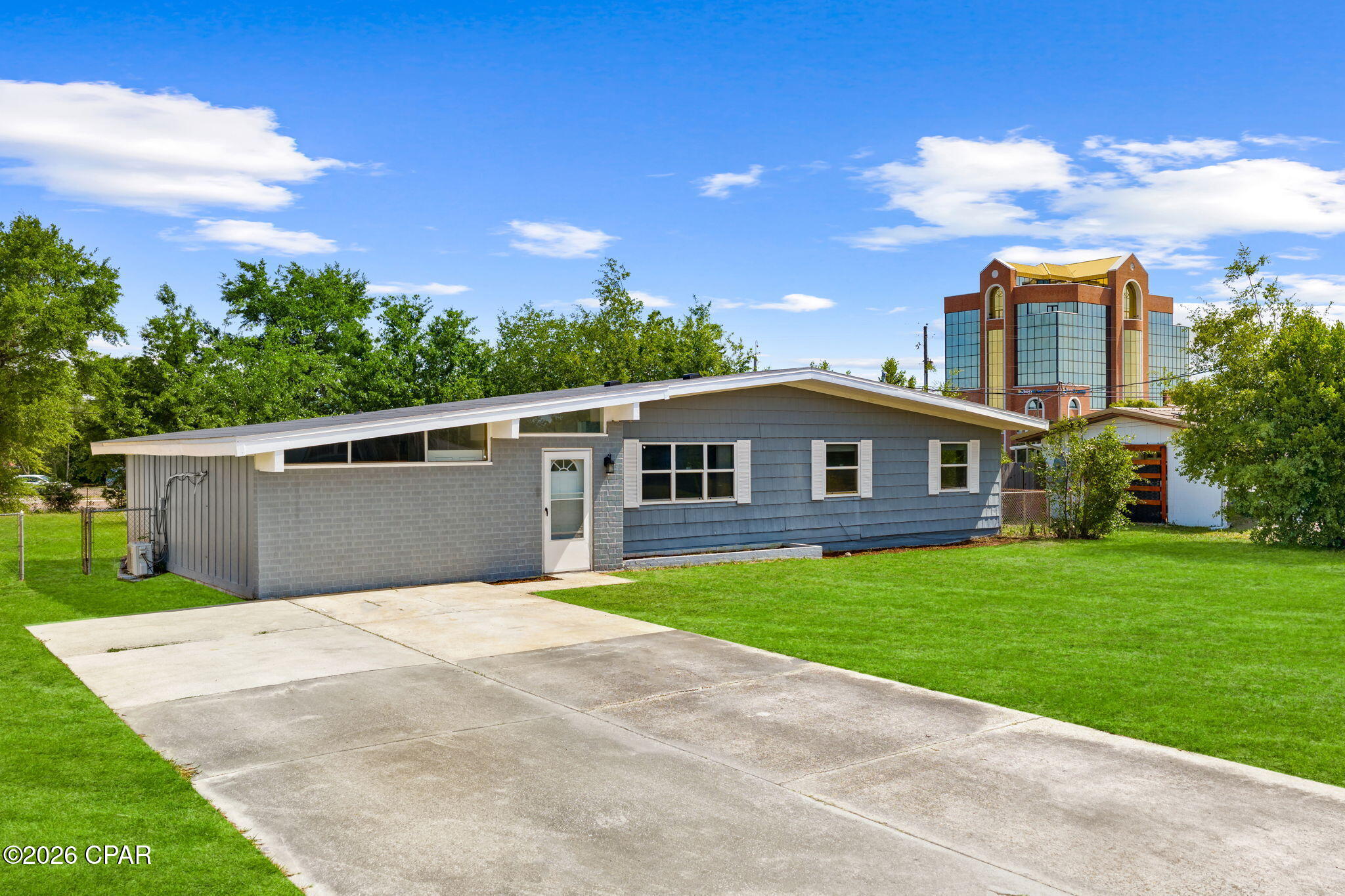 Mid-Century Character Meets Modern Convenience in Forest Park!  This home contains 3BR, 2BA and a bonus room for your personal intentions totaling 1,424 SF and has been meticulously maintained!

Discover the perfect balance of classic Florida charm and contemporary living at 1202 Emory Drive. This solid block construction home, nestled in the heart of Panama City, offers an inviting floor plan that flows seamlessly from the bright living area to the spacious kitchen--perfect for hosting gatherings. Step outside to a generous, fenced-in backyard that serves as a private oasis for weekend BBQs or gardening. Situated just minutes from the 23rd Street shopping district, local medical facilities, and a short drive to the white sands of the Gulf, this home offers a central location with a neighborhood feel. The home has a newer hot water tank, and the roof was replaced after Hurricane Michael which should ensure peace of mind for years to come. Schedule your private tour today to experience this Forest Park gem!

Washer and Dryer do not convey.

PLEASE NOTE THAT LAWN HAS BEEN AI ENHANCED DUE TO OUT OF SEASON.