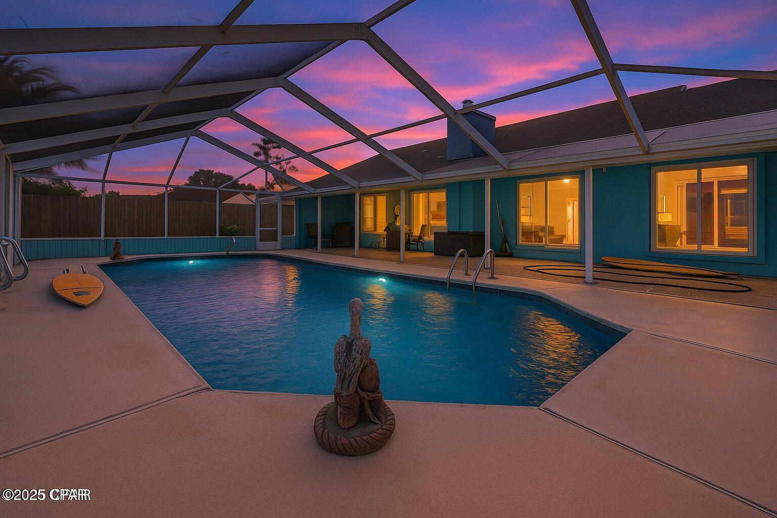 CURRENTLY UNDER CONTRACT, SELLER ACCEPTING BACKUP OFFERS  Welcome to your slice of paradise on the beach side of the bridge! Located just 1 mile from the sugar-white sands of the Gulf, this beautiful partially updated 3-bedroom, 2-bath home offers the ultimate in Florida coastal living with no HOA and easy access to the area's top restaurants, shopping, and entertainment.

Step inside to discover a bright, open living area with vaulted ceilings, a cozy gas burning fireplace, and luxury vinyl plank flooring throughout the main spaces. Large sliding glass doors flood the space with natural light and lead to the show-stopping screened-in pool area--your private backyard oasis, perfect for relaxing or entertaining guests year-round. The television and shelving below it convey with the home. 

The kitchen features sea foam green cabinetry, stainless steel appliances that include a Bosch brand stove and dishwasher, and a breakfast bar that opens to the living and dining areas, creating a perfect flow for gatherings. The spacious primary suite offers a spa-like ensuite bathroom complete with double vanity, soaking tub, and a separate shower.

Both bathrooms have been thoughtfully renovated with modern finishes. Each of the bedrooms offers ample closet space and ceiling fans. 

Outside, the fenced backyard surrounds the oversized screen-enclosed pool and covered patio--ideal for BBQs, morning coffee, or an evening swim. The two-car garage and wide driveway offer plenty of parking for your beach toys, golf cart, or boat. The home is also wired for an auxiliary generator. You just need to plug one in near the electric meter outside. 

Convenient to the Navy Base, with quick access to Thomas Drive's beachside dining, St. Andrews State Park, and all the excitement of Panama City Beach.

Whether you're searching for a primary residence, vacation home, or investment opportunity, This home is a rare find in a sought-after location. Also, NO HOA FEES! 

Schedule your private tour today and start living the beach lifestyle you've been dreaming of!