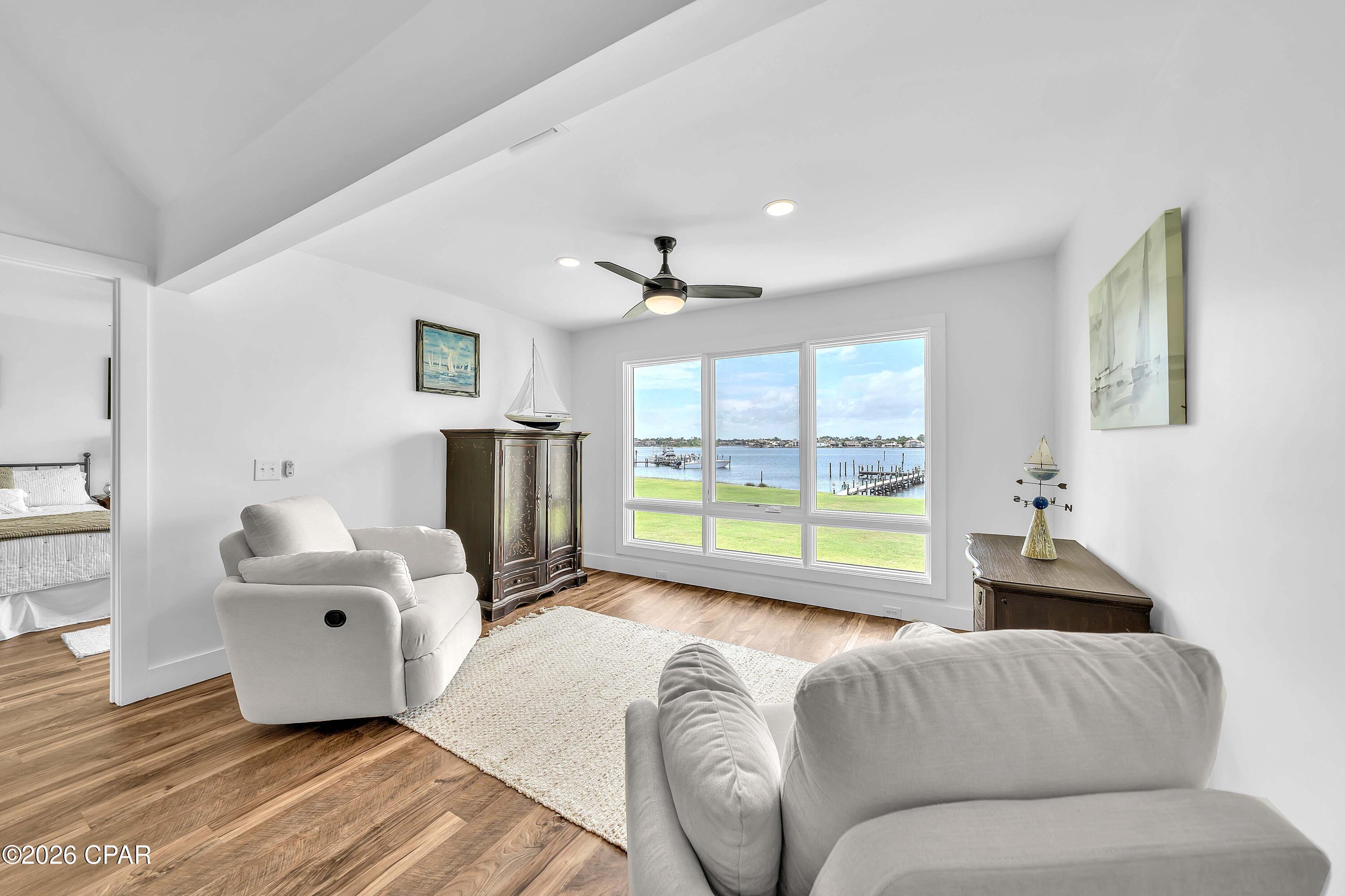 Experience the best of waterfront living in this highly sought-after Turtlegrass Villas in Bay Point, gorgeous inside and out!  This completely renovated private end unit is an exceptional 2-bedroom, 2-bath waterfront property with breathtaking panoramic views of the Bay and Lagoon.  You literally have views from every room - even the kitchen windows! Floor-to-ceiling windows in the living room showcase the stunning views and flood your home with natural light.  Turtlegrass owners enjoy access to 3 private docks, providing the rare convenience of keeping your boat just steps from home, along with opportunities for fishing and enjoying the beautifully maintained waterfront grounds. Inside, the open-concept split floor plan has been thoughtfully designed with luxury finishes throughout. The spacious primary suite features quartz countertops, dual vanities, a tiled walk-in shower, and a generous closet. The bright kitchen and dining area overlooks the Bay Point Golf Course, and your beautifully updated kitchen offers white shaker cabinetry, quartz countertops, and a center island perfect for gathering. Soaring ceilings highlight the living room, complete with a wet bar and spectacular water views, creating an ideal space for entertaining. A cozy nook provides additional seating and the perfect spot to relax while watching dolphins play and boats enter the marina. The guest suite offers its own floor-to-ceiling windows, walk-in closet, and a spacious ensuite bath with quartz countertops and a tiled tub/shower combination. This residence has been completely gutted and renovated from previous owner, including electrical, plumbing, sheetrock, flooring, and more. Additional features include a private courtyard entrance with patio and room to grill, outdoor storage closet, interior foyer storage, and utilities included except electricity and internet. Located within the prestigious gated Bay Point community with 24-hour security, residents enjoy access to a championship golf course and a full-service marina, on-site dining, all conveniently located near Panama City Beach attractions, shops and restaurants, St Andrews State Park, Navy Base, as well as boating and the beach!   Make this exceptional property your new home, vacation home, or vacation rental - call today!