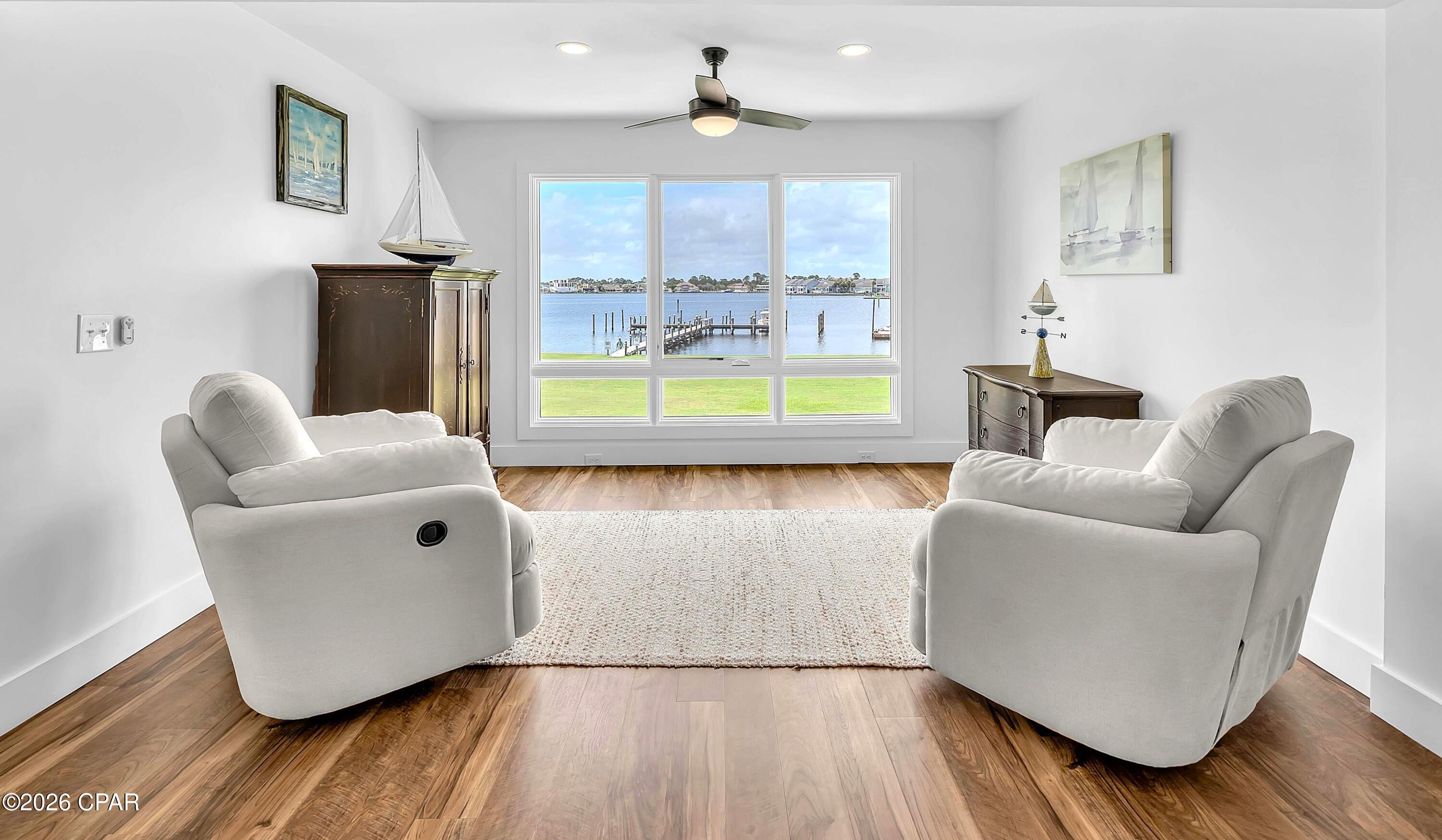 Experience the best of waterfront living in this highly sought-after Turtlegrass Villas in Bay Point, gorgeous inside and out!  This completely renovated private end unit is an exceptional 2-bedroom, 2-bath waterfront property with breathtaking panoramic views of the Bay and Lagoon.  You literally have views from every room - even the kitchen windows! Floor-to-ceiling windows in the living room showcase the stunning views and flood your home with natural light.  Turtlegrass owners enjoy access to 3 private docks, providing the rare convenience of keeping your boat just steps from home, along with opportunities for fishing and enjoying the beautifully maintained waterfront grounds. Inside, the open-concept split floor plan has been thoughtfully designed with luxury finishes throughout. The spacious primary suite features quartz countertops, dual vanities, a tiled walk-in shower, and a generous closet. The bright kitchen and dining area overlooks the Bay Point Golf Course, and your beautifully updated kitchen offers white shaker cabinetry, quartz countertops, and a center island perfect for gathering. Soaring ceilings highlight the living room, complete with a wet bar and spectacular water views, creating an ideal space for entertaining. A cozy nook provides additional seating and the perfect spot to relax while watching dolphins play and boats enter the marina. The guest suite offers its own floor-to-ceiling windows, walk-in closet, and a spacious ensuite bath with quartz countertops and a tiled tub/shower combination. This residence has been completely gutted and renovated from previous owner, including electrical, plumbing, sheetrock, flooring, and more. Additional features include a private courtyard entrance with patio and room to grill, outdoor storage closet, interior foyer storage, and utilities included except electricity and internet. Located within the prestigious gated Bay Point community with 24-hour security, residents enjoy access to a championship golf course and a full-service marina, on-site dining, all conveniently located near Panama City Beach attractions, shops and restaurants, St Andrews State Park, Navy Base, as well as boating and the beach!   Make this exceptional property your new home, vacation home, or vacation rental - call today!