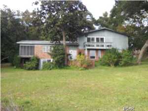 This is not a short sale. This extremely spacious 5 bedroom waterfront home is a must see. It features generous living areas, dining area and bedrooms. The kitchen has a glass access door to the yard. There are many windows to capture the sun and give you gorgeous water views. Brick fronted fireplace. There is a balcony, a first floor deck and a lovely enclosed 2nd floor patio. Outbuilding on property for extra storage or a workshop. The master bathroom features a gorgeous garden tub with tiled surround and stained glass motif artwork.All Information recorded in the MLS is intended to be accurate but cannot be guaranteed, buyer advised to verify. Sold As-Is.