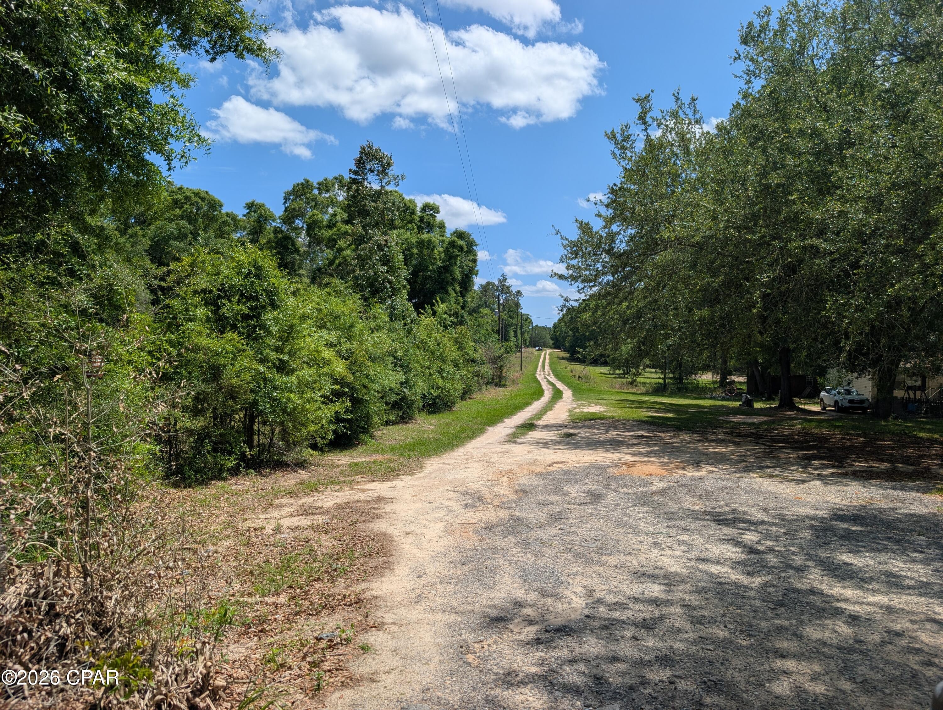 Very nice building lot in Cricket village. Lot is lightly wooded with some nice shade trees. Located close to the schools and local shopping. With a little bit of clearing will make a nice homesite. Mobile homes are allowed. Only an hour away from Panama City Beach. Land and Home packages are available in this Sub- Division.