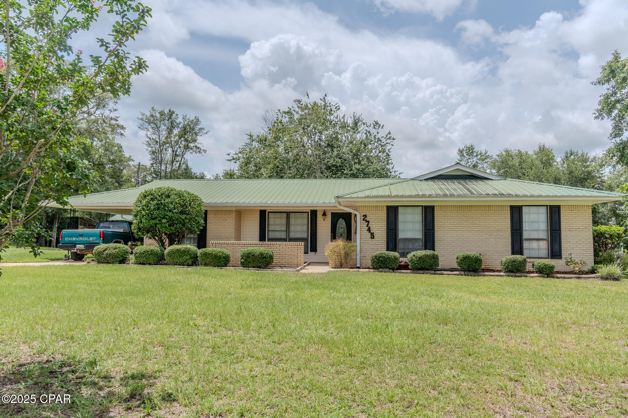 Imagine yourself surrounded by the tranquility of 3 acres in this well-maintained 3 bedroom, 2 bathroom brick home. This property offers more than just a residence; it's a lifestyle. Four outbuildings, three equipped with electricity and one featuring a convenient half-bath, present endless possibilities for workshops, studios, or storage.  Two of the outbuildings have air conditioners. Step inside to discover a beautifully remodeled kitchen complete with custom cabinets, a walk-in pantry, and indulge in the spa-like experience of the new bathrooms with their custom tile showers. The master suite offers a dream-come-true walk-in closet. New tile flooring in a large portion of the house. HVAC system was installed in 2023.  New septic system and drain fields.  Relax in the sunroom or entertain on the covered back patio. This is more than just a house; it's an opportunity to create your ideal country retreat. Some photos are virtually staged. Make an appointment to make it yours!
