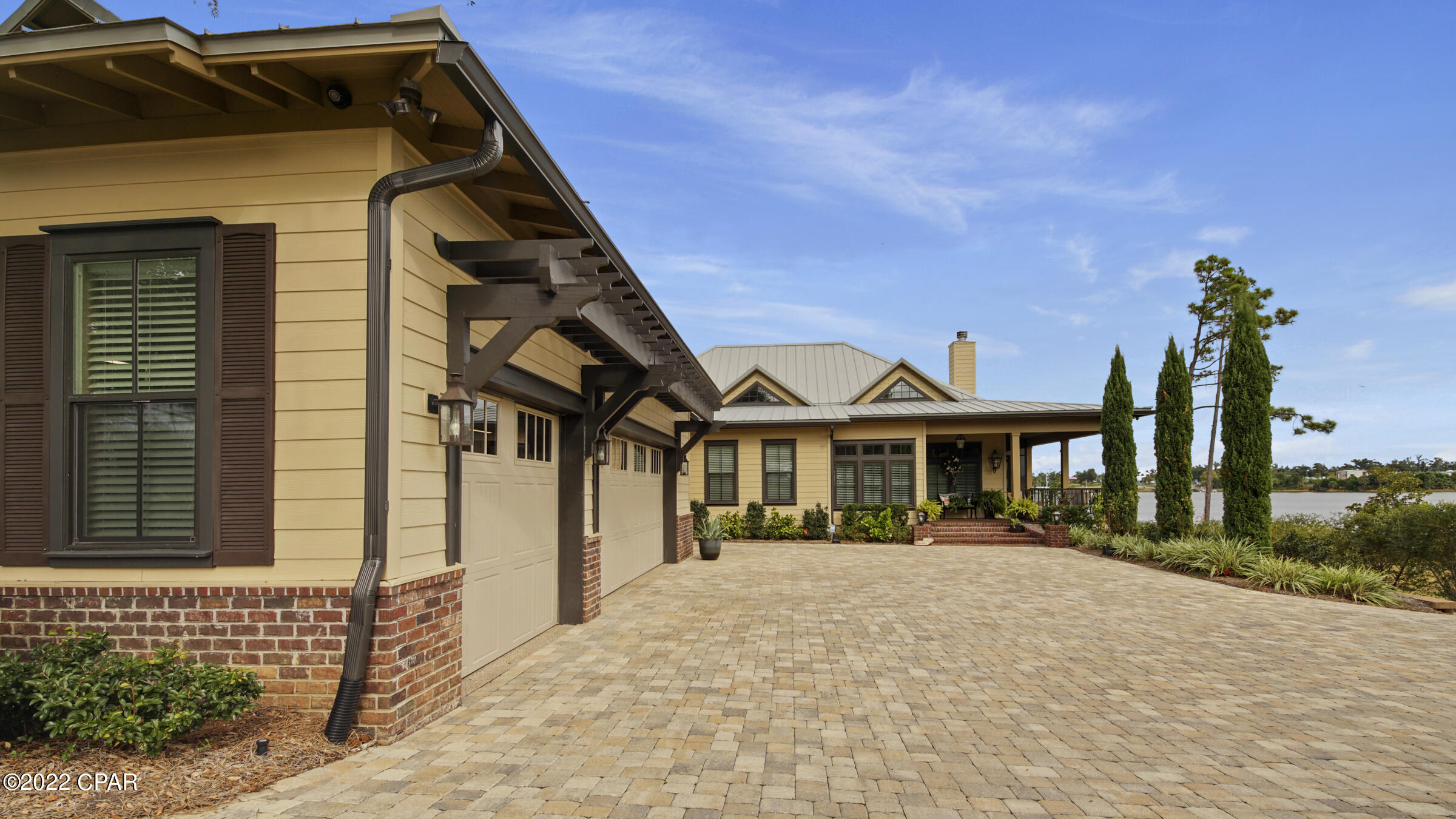 Panoramic views of Watson Bayou from this custom-built home will provide a space for entertaining family and friends.  Watson Bayou provides deep water access and easy access to the Gulf.  The great room has 20' tongue and groove wood cathedral ceiling.  Four 8' tall sliding glass doors in the family room open to the screened in porch to relax and enjoy the water views.  The chef's kitchen features a 4'X 9' island with prep sink, gas cooktop, quartz countertops and a huge walk-in pantry. Built-in Kitchen Aid stainless appliances to include two dishwashers, double ovens, and an ice maker.  The master bedroom includes his and hers walk-in closets.  The master en suite features double vanities and a large double shower.  The additional bedroom also has an en suite. The office has a closet and could be converted to bedroom.  The laundry room features cabinetry and a sink.  A bonus room above the garage features a bathroom, living area and kitchenette.  The wrap around screened porches, and open decks are an oasis.