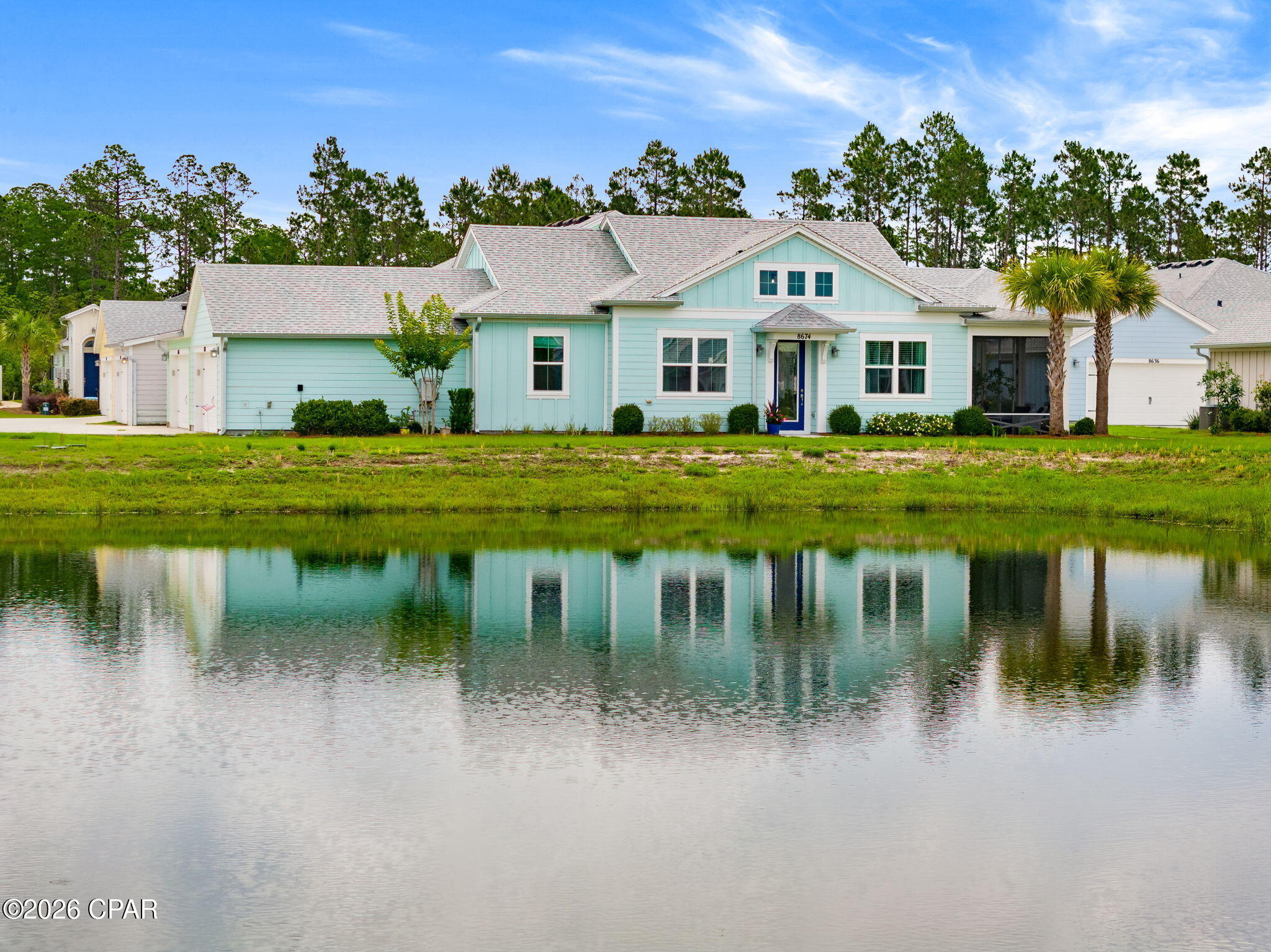 Experience some of the most spectacular sunset views in Latitude Margaritaville Watersound from this highly upgraded, Aloha Cottage in sought-after close-in Phase 4. Perfectly positioned on one of the largest ponds in the community, this exceptional homesite offers unobstructed water views and breathtaking sunsets that create a truly one-of-a-kind setting.

This beautifully appointed home is being offered furnished and includes a 2024 Evolution golf cart (see exclusions), making it easy to begin enjoying the Latitude lifestyle immediately. Inside, you'll find numerous upgrades including granite countertops, designer tile backsplash, upgraded cabinetry throughout, custom lighting and ceiling fans, Revwood by Mohawk laminate flooring, and custom feature walls in the living room, dining area, and primary suite.

The spacious primary suite features a luxurious, fully renovated spa-inspired bath with a designer tiled walk-in shower, oversized niche, frameless glass enclosure, accessible grab bar, and custom closet system. A secondary bedroom is conveniently located adjacent to a full bath, while the versatile den/office provides ideal space for a home office, hobby room, or overflow guest accommodations.

Step outside to the fully screened lanai and enjoy peaceful pond views, abundant wildlife, and unforgettable sunsets. Additional features include custom closets throughout, whole-house water filtration system, additional attic flooring and storage, upgraded garage door opener with integrated camera, and stunning exterior holiday lighting.

Enjoy added peace of mind with the a builder's 10-year structural warranty from the original build date and the cottage HOA dues provides lawncare and irrigation, plus scheduled exterior painting and roof replacement. 

Latitude Margaritaville Watersound is Northwest Florida's premier 55+ active adult community, offering resort-style amenities including a 2 story full service restaurant, paradise pool, indoor lap pool, state-of-the-art fitness center, pickleball and tennis courts, walking and biking trails, dog parks, live entertainment, clubs, social activities, and more. Located approximately 7 miles from the sugar-white sands of Panama City Beach, residents enjoy the perfect blend of coastal living and resort-style convenience.

The area continues to grow with exciting new developments nearby, including a new Publix-anchored shopping and dining district, additional retail and restaurant options, and a new hospital currently under construction just minutes away, making this location even more desirable for full-time residents and seasonal homeowners alike.

Don't miss this rare opportunity to own a beautifully upgraded waterfront cottage with some of the finest sunset views in the community. Live where every day feels like a vacation.