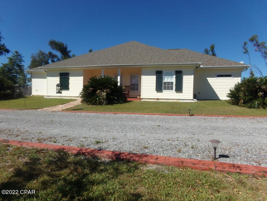 5 acre lot! 3/2 home(built 2005), pool with screened enclosure & separate outside electric meter, 4 car carport & 36x48 workshop with 2 roll up doors & separate electric meter. Home features include: custom oak cabinets,walk in pantry,stainless steel appliances, propane gas stove, double dishwasher, hardwood floor in the dining room,multiple walk in closets & ceiling fans, wired for sound & alarm system, also handicapped accessible.New Roof,AC,Water Heater after Michael. 2005 survey on file. Any/all info taken from appraiser site & sizes approx., buyer to verify.