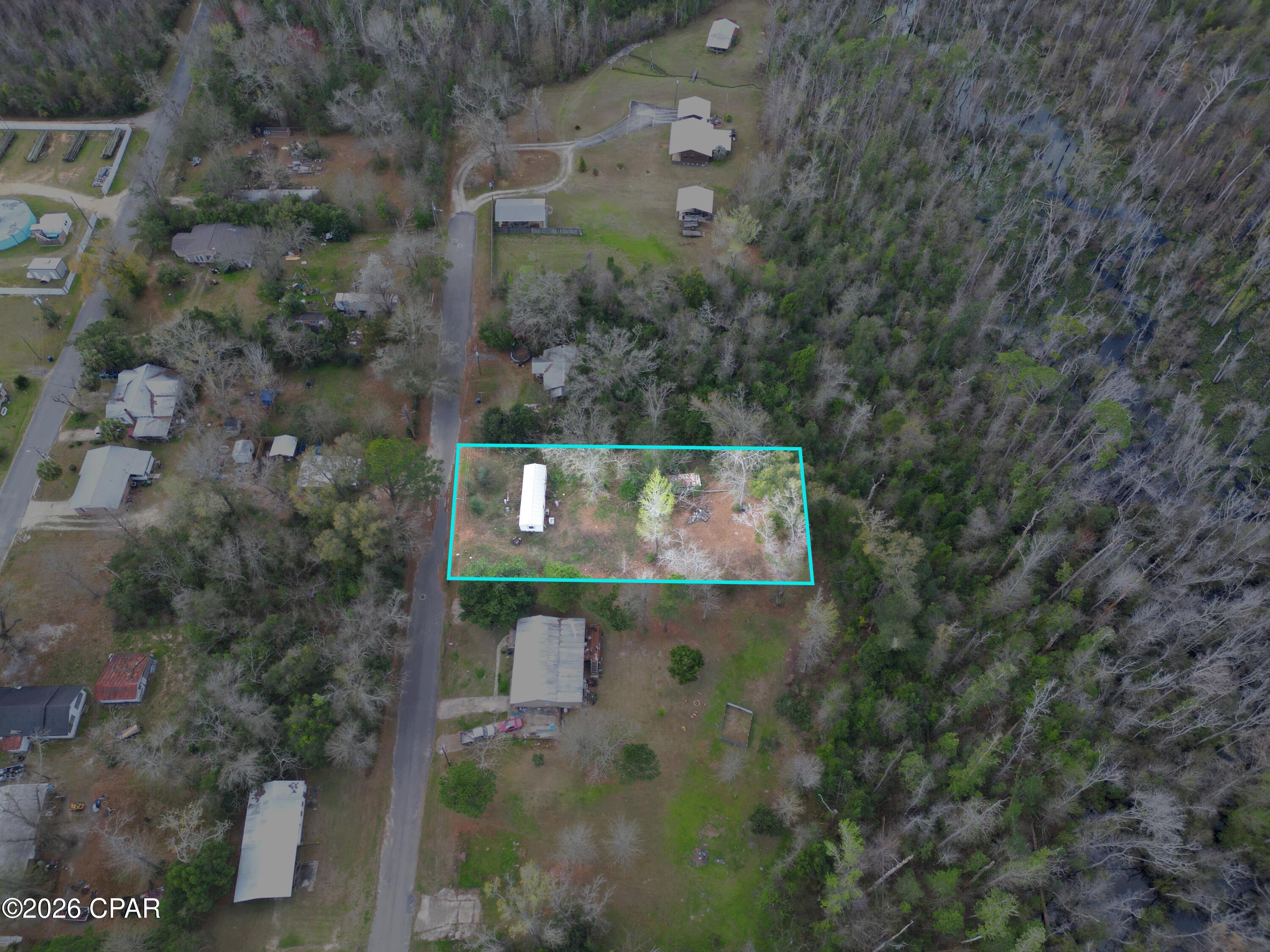 0.67 acres • City utilities available • Paved frontage • No HOA • Partially cleared • Shed • McClellan Subdivision

Set in the City of Blountstown with a Blountstown mailing address, this approx. 0.67-acre vacant residential parcel offers paved road frontage and city utilities available. The property at 20237 NW McClellan Ave includes Lots 5 and 6 in McClellan Subdivision, giving you a practical in-town setting with room to plan your next use. The lot is partially cleared, which helps show the shape of the land while still leaving natural cover in place. A shed is located on the property for added storage potential. No HOA gives added flexibility for future plans, subject to city and county requirements. Nearby everyday stops include Piggly Wiggly, Blountstown Drugs, McDonald's, and the Blountstown Public Library, all within a short drive. Existing trailer on site is considered of no value and is not included as a contributing improvement. Buyer to verify zoning, utility connections, building requirements, lot dimensions, and any permitting needs.