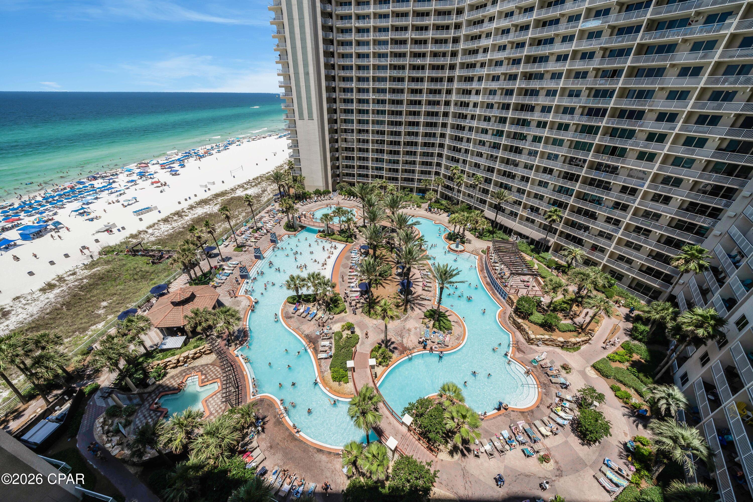 This wonderful 11th floor unit comes with your own dedicated parking spot at Shores of Panama! Spacious 1 bedroom, 2 bathroom condo with a private bunk space and amazing west facing views. Take in the beautiful sunset and views of the resort and incredible pool area while you unwind on the spacious balcony. As you enter the unit to your left is the large master bedroom which features views of the gorgeous emerald coast. Enjoy your en suite bathroom with shower/tub combo. Just down the hall is a bunk room with an adjoining bathroom, features a walk-in shower that is in high demand with guests. The Owners just had new barn doors installed giving the guests in that space added privacy. The kitchen offers ample room to prepare meals, features stainless steel appliances, a pantry for extra storage and a brand-new stainless farmhouse sink. The pantry could also easily be converted into an Owner's Closet. The open living space leaves plenty of room for dining and comfortable seating to kick back and relax after a long day at the beach. Shores of Panama has wonderful amenities including a heated indoor pool, indoor spa tubs, tiki bars, a gym and on-site dining. Shores is in a perfect location giving you and your guests easy access to stores, restaurants and entertainment, soon to include the brand-new Tootsie's on the beach. Reach out to your favorite Realtor to learn more!