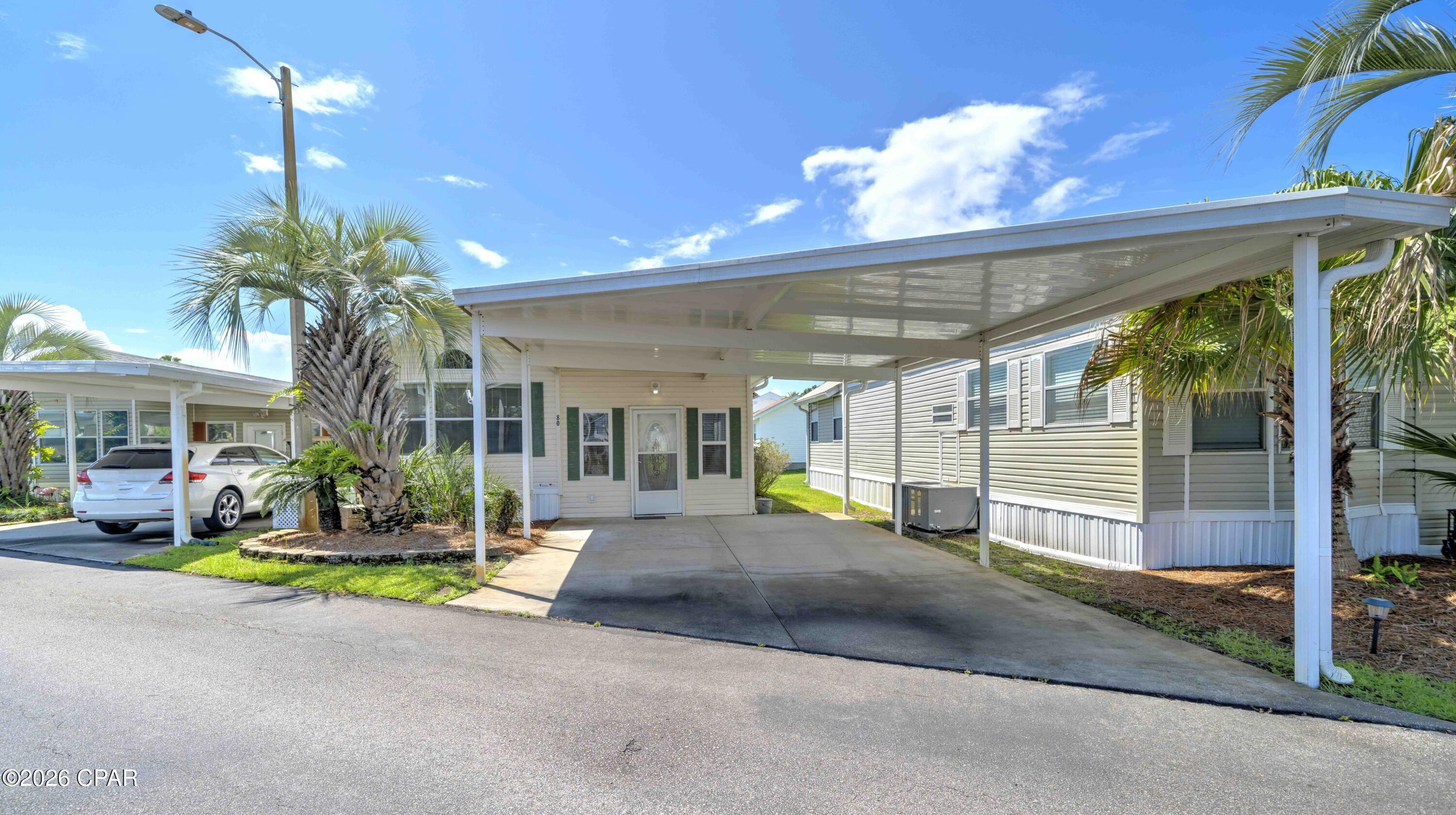 Welcome home to this move-in-ready 1-bedroom, 2-bath, 756 sq. ft. residence in Emerald Pointe Resort--a cozy beach retreat in one of Panama City Beach's most desirable communities. The home features a spacious living room, dining area, large primary bedroom, ensuite bath with walk-in shower, screened-in lanai with storage, and a flexible second living area that can be closed off for overnight guests.  The laundry room fits a full-size washer and dryer, and the lot provides extra space for future expansion. Recent updates include fresh interior paint, new carpet, a 2023 roof, and a 2017 HVAC system.
Emerald Pointe Resort is a gated community on the quiet East end of Panama City Beach, near popular restaurants, shopping, and beaches known for their sugar-white sand and emerald-green waters. Amenities feature a spacious clubhouse, fitness center, shared library, two pools (one heated seasonally), hot tub, lake with boardwalk, and shuffleboard court. The HOA fee covers water, sewer, garbage, Wi-Fi, and lawn care. Don't let this incredible property slip through your fingers! Schedule a tour today and see for yourself what this amazing property has to offer. Please note: All information is approximate and should be verified by the buyer if important.