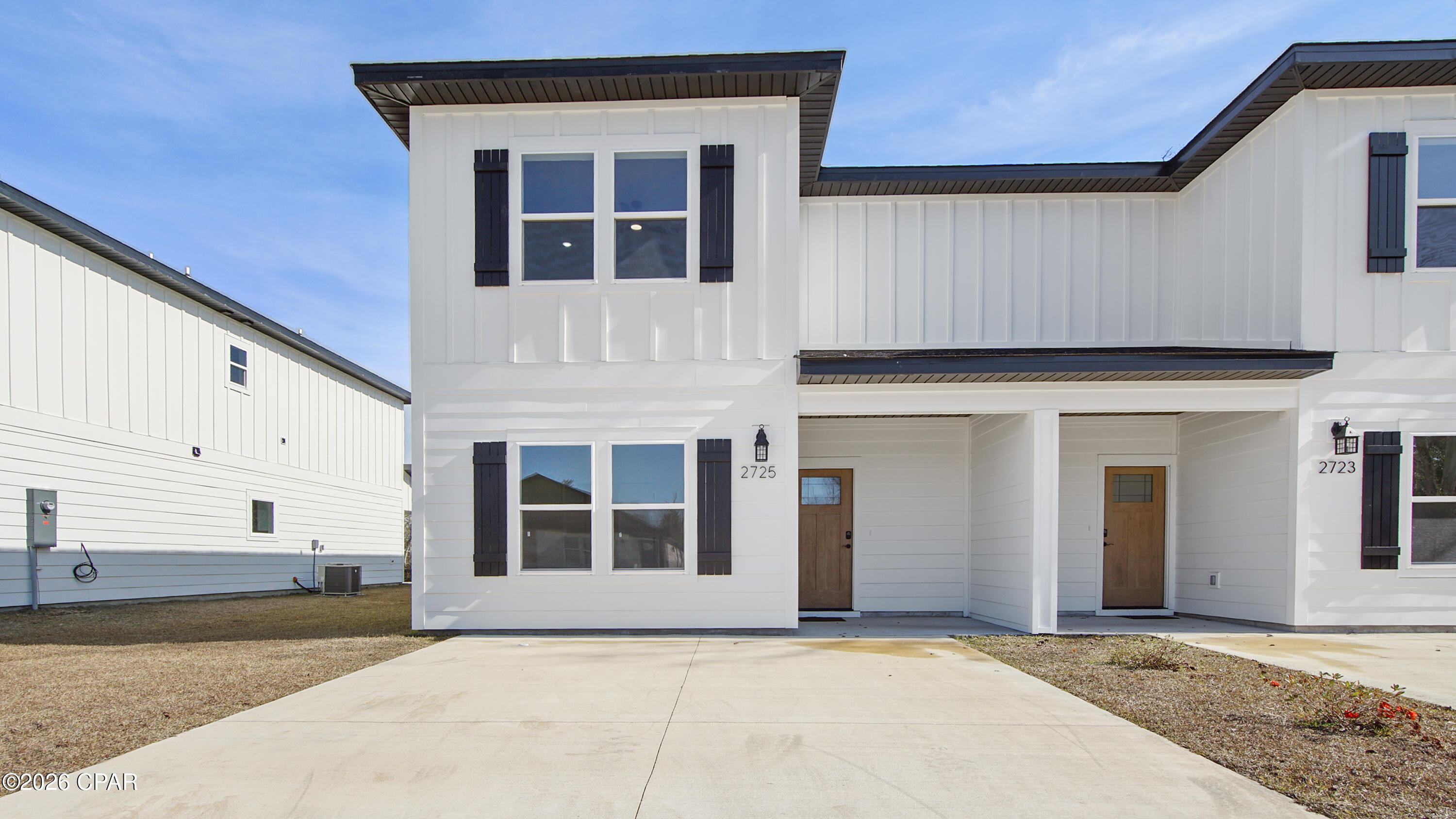 New construction in Panama City, FL with no HOA and short-term rentals allowed, perfect for a primary residence, second home, or investment property. Located near Highway 231 with easy access to shopping, dining, and just 18 minutes from Tyndall Air Force Base, this move-in-ready home features an open floor plan with luxury vinyl plank flooring throughout. The modern kitchen offers white shaker cabinets, soft-close drawers, quartz countertops, stainless steel appliances, a large center island, and a spacious walk-in pantry. The main level includes a bedroom and full bath ideal for guests or a home office, plus a covered back porch for outdoor living. Upstairs, enjoy a split floor plan with a large primary retreat (13'7'' x 15'8'') featuring a walk-in closet and en-suite bath with double vanities and quartz countertops, along with two additional large bedrooms, a full bath, and upstairs laundry. Built with durable Hardie board siding, a fully sodded yard, a Rheem tankless water heater, and backed by a one-year builder warranty and ten-year structural warranty, this low-maintenance townhome offers modern finishes, flexibility, and long-term value.