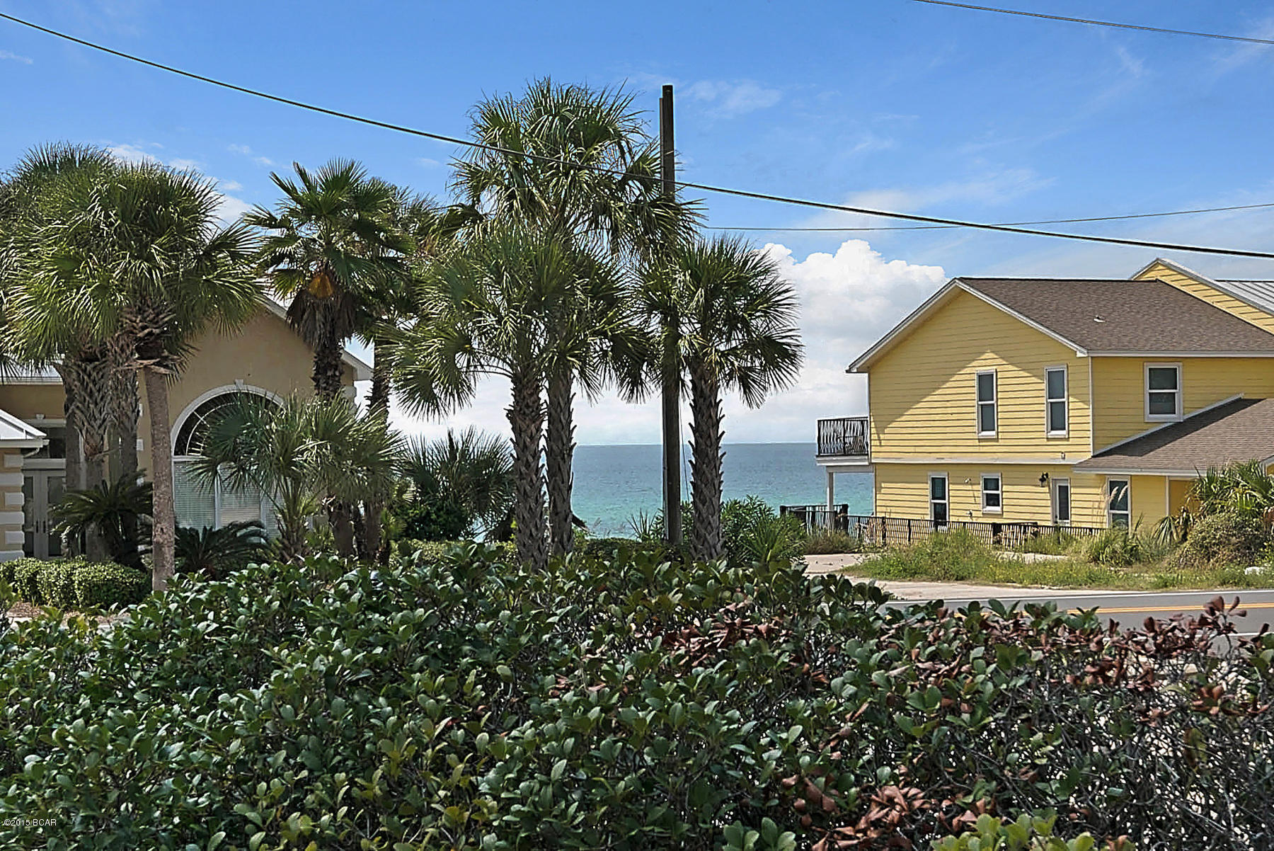 Directly across the street from the beach and easy beach access. This 2 BR/ 2.5 bath condo was totally remodeled from top to bottom and it shows. Porcelain wood-grain tile on main level, hardwood floors upstairs, gorgeous granite counter tops and snack bar, stainless steel Kitchenaid appliances including 5 burner gas cook top, dual zone HVAC is only a few years old, frameless glass shower enclosures and beautiful tile work in both baths, the upstairs balcony was enclosed and added to the master BR...nothing but the best. Make sure this one is on your list.