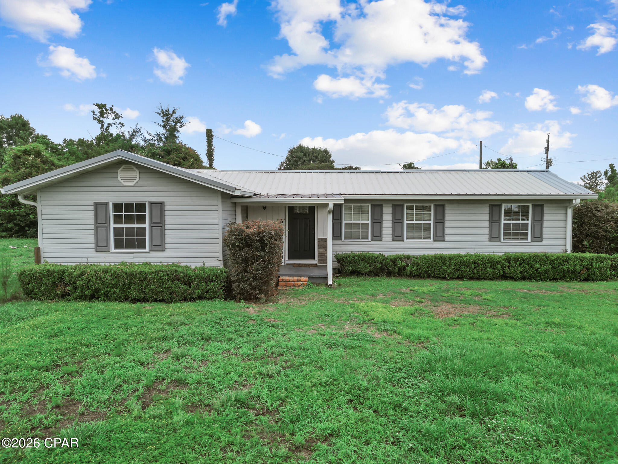 Looking for a place where you can slow down, spread out, and enjoy the simple things in life? Welcome to 19044 NE Elijah Morris Road in Blountstown, Florida.

This 3-bedroom, 1.5-bath home offers approximately 1,716 square feet of living space and the opportunity to create a property that fits your lifestyle. Built in 1950, the home features a spacious layout, a partially fenced yard, and a storage shed that provides extra room for tools, equipment, or hobbies.

Imagine enjoying mornings with a cup of coffee, spending evenings outdoors, and having space for pets, gardening, or simply relaxing in your own backyard. The roof was replaced approximately six years ago, providing added peace of mind for future ownership.

Conveniently located about an hour from Panama City, Mexico Beach, and Dothan, Alabama, you'll enjoy the benefits of country living while still having easy access to shopping, dining, employment centers, and the Gulf Coast's beautiful beaches.

Whether you're looking for a primary residence, an investment opportunity, or a property you can make your own, this home offers plenty of potential and a location that keeps you connected to everything North Florida has to offer.