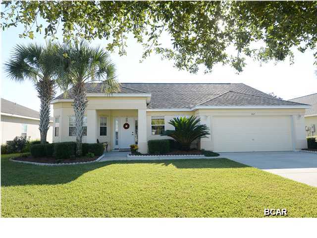 **LOTS LIKE THIS IN PALMETTO TRACE DON'T COME AVAILABLE OFTEN** **FRESH PAINT INSIDE** **VACANT** Do you want to live close to Pier Park, have a LARGE BACKYARD, enjoy peaceful views of a pond with no neighbors behind you? If so, this is the house for you! This 3BR/2BA has an open floor plan and is in truly fantastic condition. Inside, this lovely home features tile in all wet areas and carpet everywhere else. The kitchen is well designed with plenty of cabinets and counter space overlooking the large, main living area. Enjoy more formal meals in the dining room or convert it to an office, play area or sitting room. The master suite includes a nice-sized bedroom with an entrance to the screened-in patio while the master bathroom has his and hers closets, a double vanity and a nicely