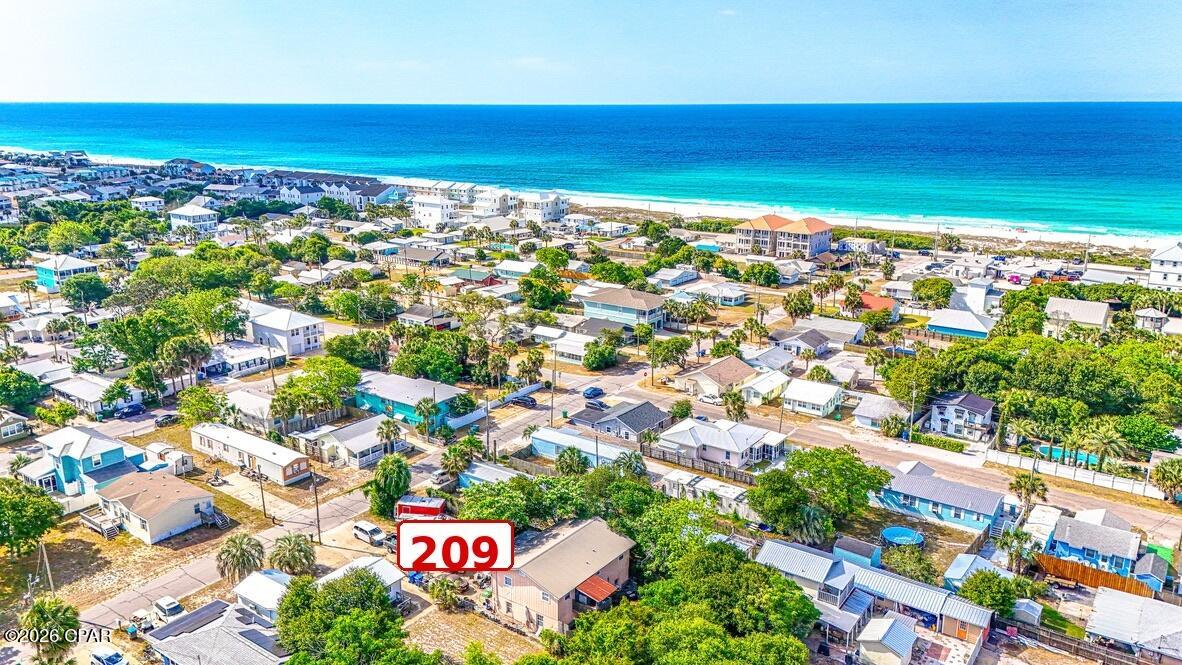 Prime Laguna Beach Opportunity -- Deeded Beach Access + Gulf View Potential

A deep 50' x 150' lot with deeded beach access, vacation-rental zoning, duplex potential, and Gulf-view upside -- all in one of Laguna Beach's most desirable, least commercialized beach pockets. Located just one block from the sand and near the iconic Thomas Donut & Snack Shop, this property offers exceptional flexibility for renovation, rental income, or redevelopment.

The existing 4-bedroom, 3-bath structure has a versatile layout, including a 2-bedroom, 1-bath upstairs unit, a 1-bedroom, 1-bath downstairs unit with kitchen, plus an additional efficiency-style space. The property may offer strong potential as a triplex-style income property, subject to zoning, permitting, and county approval.

Buyers may also explore renovating the existing structure, adding onto it, or redeveloping the lot entirely. With its deep lot size, duplex zoning potential, vacation-rental appeal, and beachside location, this is a rare opportunity for an investor, builder, or buyer looking to create a high-value coastal asset near the Gulf. 205 and 207 are owned by the same seller and may be purchased together. 209 is owned by a separate seller and is also available for sale. 209 may be purchased separately or potentially combined with 205 and/or 207 for a larger redevelopment opportunity.

Buyer to verify all zoning, rental, renovation, redevelopment, and view potential.