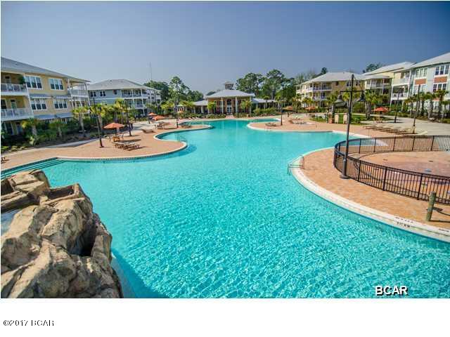 Ground floor 2 bedroom, 2.5 bath, 1325 sq. ft. condo in the tranquil gated community of Island Reserve. This unit has been freshly painted and features bamboo flooring in the living area, tile in the kitchen, bathrooms, laundry and foyer, and carpet in the bedrooms, all with 10' ceilings. Kitchen includes granite countertops and island, stainless steel appliances, and lots of wood cabinetry. Bonus amenities include washer and dryer, window coverings, large patio and covered garage parking and entry. The Island Reserve community features gorgeous landscaping, fountains, paved walkways. Amenities include fitness center, media center, indoor basketball court, aerobic center, game room and community room. And don't forget the resort style pool. No pets. Water, sewer and garbage are included.