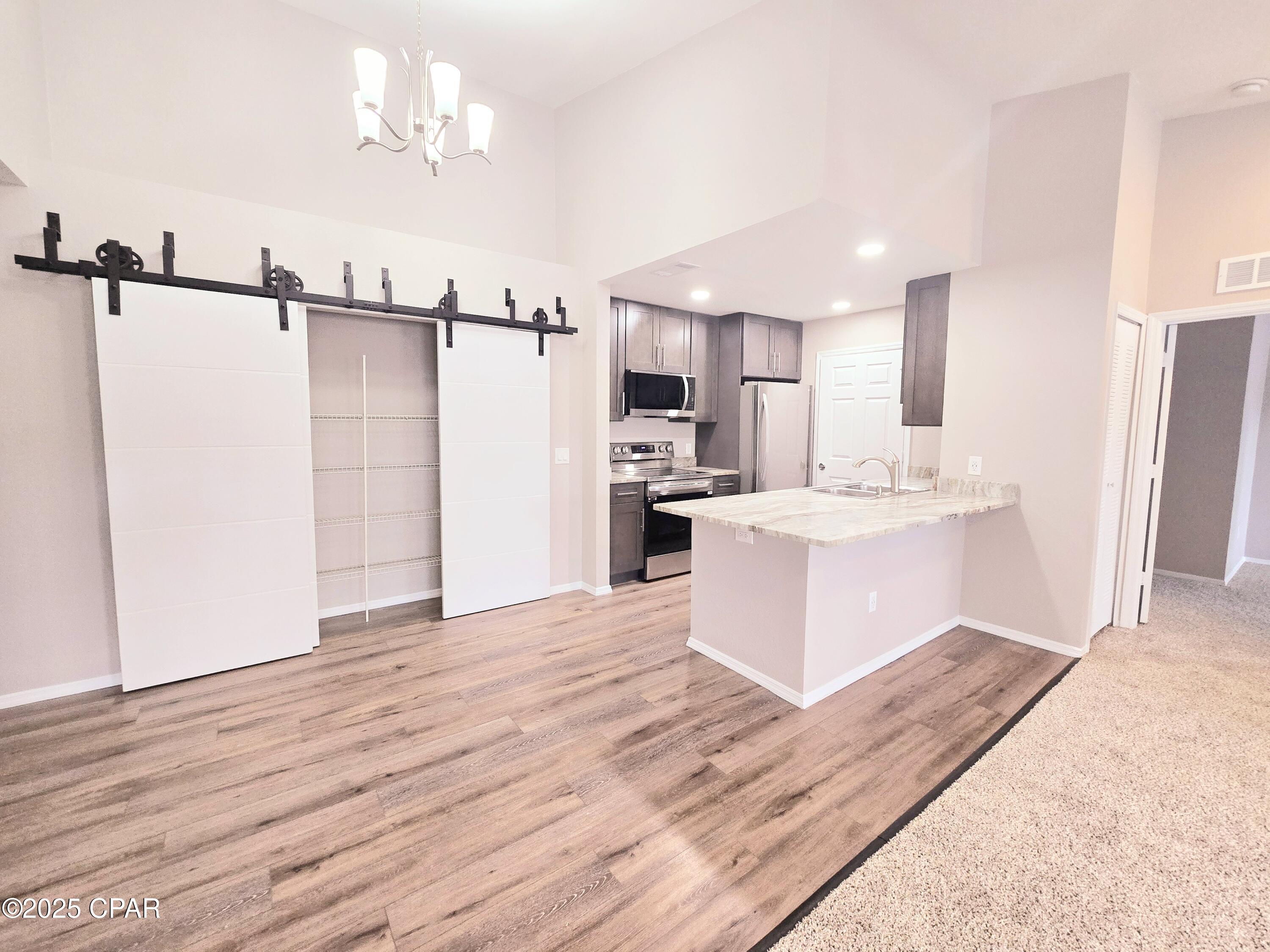 Spacious 4-Bedroom, 3-Bath Condo in Prime Panama City Beach Location

This well-appointed 4-bedroom, 3-bathroom condo offers the perfect combination of space, comfort, and convenience. With vaulted ceilings and an open layout, the home feels bright, airy, and inviting from the moment you walk in.

The kitchen features granite countertops, stainless steel appliances, and a large pantry, providing both functionality and ample storage. Each bedroom is generously sized, including a private ensuite fourth bedroom--ideal for guests, a home office, or additional privacy. The primary suite includes two walk-in closets, offering excellent storage and organization.

Residents enjoy access to a beautifully maintained community with outdoor grilling areas, picnic tables, and resort-style amenities. The community features a swimming pool, clubhouse with a full kitchen, fitness center, and playground--perfect for both relaxation and everyday living.

Prime Location:
Conveniently located within walking distance to restaurants and shopping, this home is also just minutes from the beach. Enjoy:

Approximately 3,500 feet to the white sandy beaches of Panama City Beach
1 mile to Pier Park, the area's premier shopping, dining, and entertainment destination
1.5 miles to Frank Brown Park, featuring sports fields, walking trails, an aquatic center, and year-round events

This is an excellent opportunity to live in one of the most desirable areas along the Gulf Coast. Homes in this location and condition do not last long.
