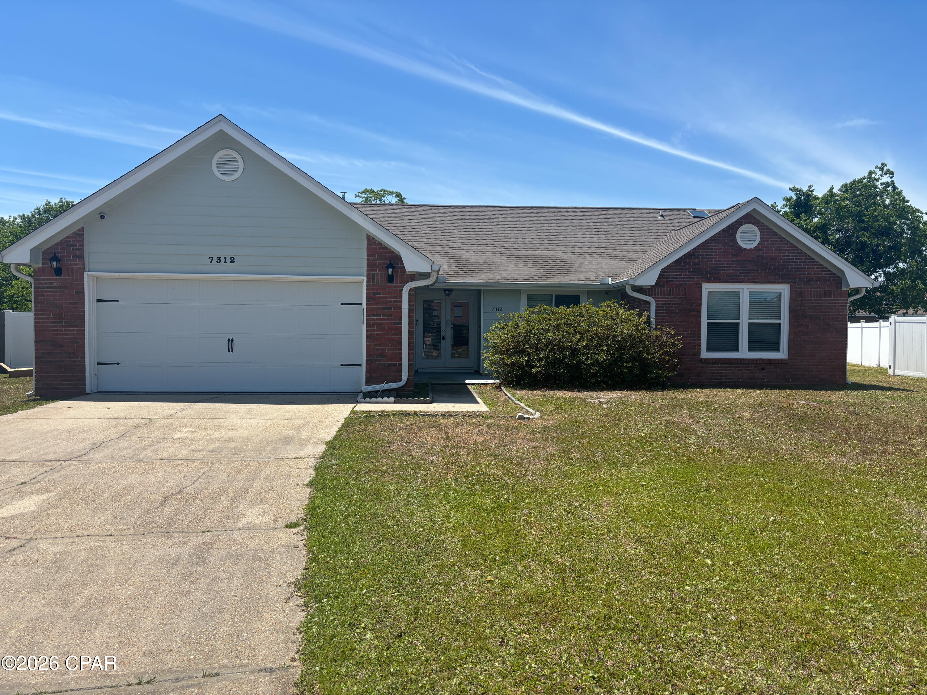 In Callaway Point well-maintained 3-bedroom, 2-bath home that affords comfortable living with practical features. The split-bedroom floor plan provides privacy, with a primary suite that includes a sitting area. The kitchen offers a gas stove and adjoins flexible living space ideal for a home office, dining area, or play nook. Tile flows through most of the home while the two additional bedrooms are carpeted. Systems include gas heat and a gas water heater. Outside, enjoy a large screened back porch and a private, fenced backyard, plus a spacious 2-car garage. Located just minutes from Tyndall AFB, this property provides convenient access to nearby shopping and restaurants.