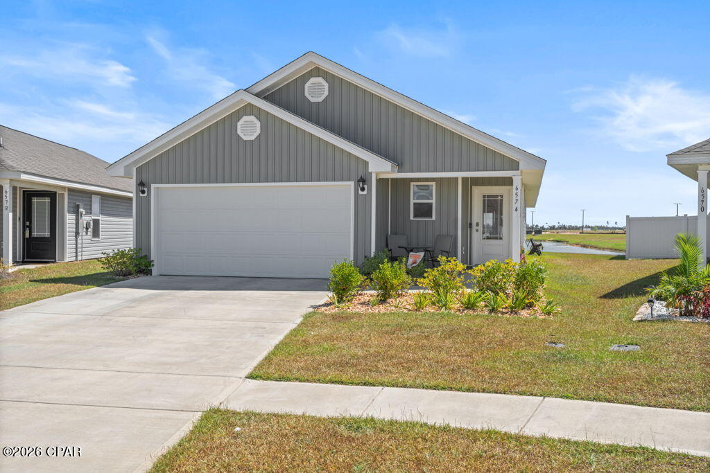 PRICE REDUCTION AND VA ASSUMABLE MORTGAGE AT 4.99%.  Enjoy peaceful pondside living in this spacious 1,648 square foot 3-bedroom home featuring an open-concept layout, scenic views, and a location that offers both convenience and tranquility. Located on a larger than average lot and in a sidewalk community with an abundance of amenities including pools, pickleball courts, playground, card room, barbecue grill, basketball courts, and a fitness center, this neighborhood is ideal for runners and anyone who loves to get outside for walks and enjoy the Florida weather. Ideally situated just 25 minutes from the beach, 15 minutes from town, and a short drive to Tyndall Air Force Base, this home is also just down the road from the new Publix and Starbucks. At the heart of the home is a chef's kitchen with a large island, walk-in pantry and granite countertops, flowing seamlessly into the main living area for easy everyday living and entertaining. Custom finishes in the primary suite add comfort and character, while the screened-in back patio provides the perfect place to unwind and take in serene pond views and beautiful daily sunrises. Tucked away on a quiet dead-end street with no through traffic, this home offers a peaceful setting with both privacy and everyday convenience.  You won't want to miss the opportunity to check this one out!  Measurements are appxomate and should be varified if important.