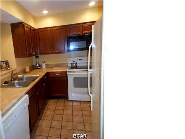 One of a few unique floor plans offered in the gated Golf Villas of Edgewater Beach Resort! This townhouse design features 2 Bedrooms, 3 full Baths, 2 balconies, and a split AC system. It truly has one of the BEST VIEWS in this resort overlooking the 8th hole of the golf course, a beautiful lake, and a peek of the gulf from the upstairs balcony. Kitchen and Baths were remodeled with beautiful cabinets and vanities. Golf Villa 119 is in a great location near the entrance to the villas with easy access to Richard Jackson/Front Beach Rd, the Shoppes at Edgewater, great restaurants and the sugar white sands and emerald green waters of Panama City Beach. Great rental income! Edgewater Beach Resort is one of the best full service resorts in Panama City featuring a par three golf course,