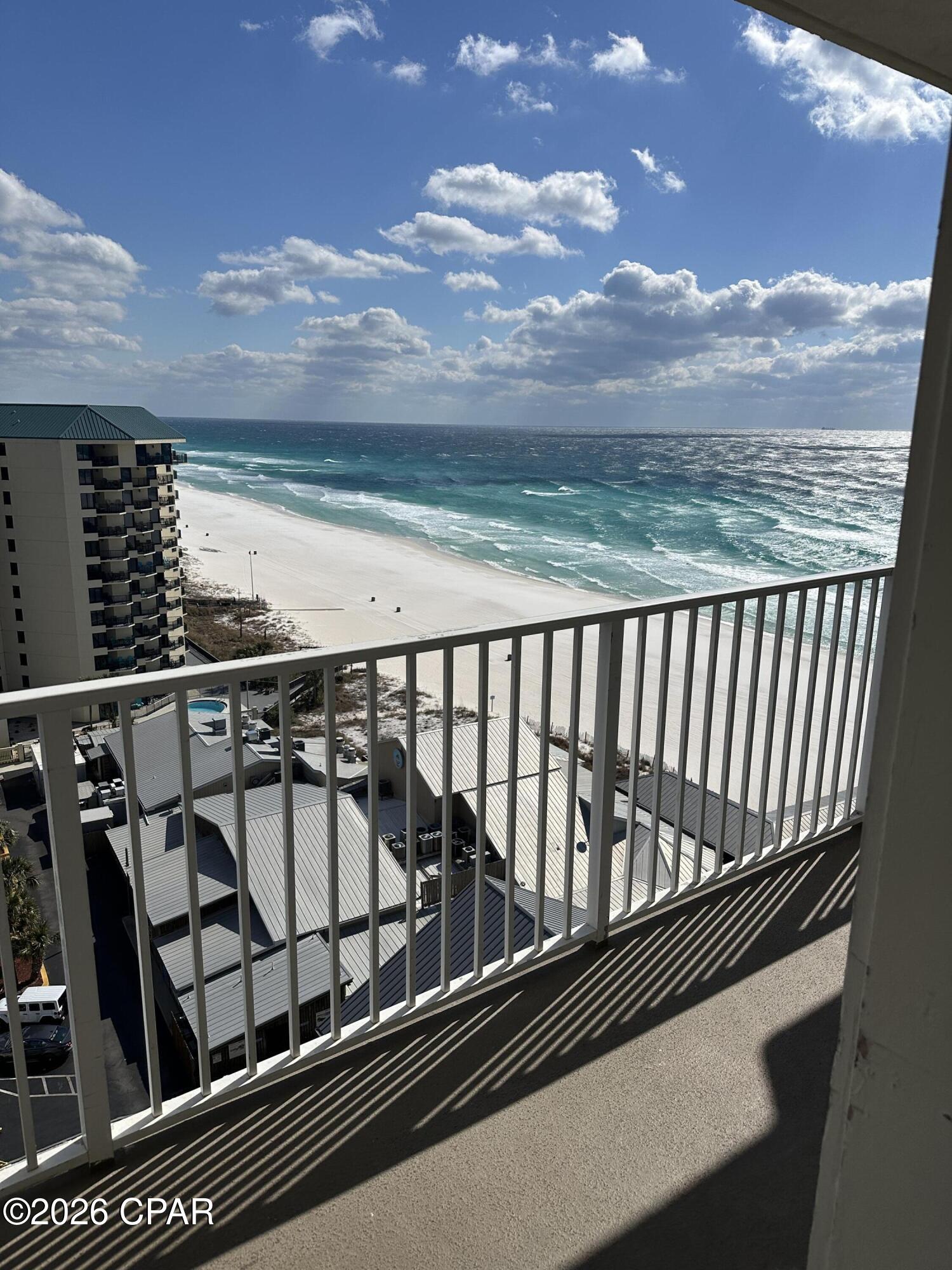 Discover exceptional value and breathtaking views in this 12th-floor Gulf-view condo at Shores of Panama, ideally positioned in the heart of Panama City Beach. Priced at $310,000, this 936-square-foot condo presents one of the best opportunities in the resort for both personal enjoyment and rental performance. Thoughtfully designed, the layout includes one private bedroom overlooking the emerald waters, two full bathrooms, and a separate bunk room that comfortably accommodates additional guests—making it ideal for maximizing occupancy and rental income. The open-concept living and dining area flows seamlessly into a fully equipped kitchen, creating a welcoming space for entertaining or relaxing after a day at the beach.

Step onto your private balcony and take in panoramic Gulf views, coastal breezes, and unforgettable sunsets. Additional conveniences include in-unit laundry and the benefit of being sold fully furnished—turnkey and ready for immediate enjoyment or rental placement.

The condo conveys fully furnished and rental-ready, making it an effortless investment opportunity or turnkey beach retreat. This unit also includes one deeded parking space. 
Shores of Panama is home to the largest Gulf-front lagoon pool in Panama City Beach, with its spectacular 14,000+ sq ft zero-entry lagoon pool with palm-lined islands, fountains, and expansive hot tub. tropical palm islands, fountains, and an oversized hot tub—all just steps from exclusive beachfront access. Owners and guests also enjoy:  Indoor heated pool and hot tub, 24-hour fitness center, Seasonal poolside Tiki bar, Covered parking, and On-site security.
The location is unbeatable—walk next door to Pineapple Willy's for beachfront dining or cross the street to Laketown Wharf for multiple dining options including The Wharf Buffet, Juan Taco, and LuLu's Bar & Restaurant. Shopping, entertainment, and attractions are all within easy reach.
If you're looking for a well-positioned Gulf-front condo with proven rental appeal and unbeatable amenities—this is a standout opportunity. With exterior renovations scheduled to enhance curb appeal and long-term value, this is a strategic opportunity to secure this wonderful gulf front condo—ideal as a personal retreat, income powerhouse, or both. All information and HOA details are believed accurate but should be verified by buyers if important.