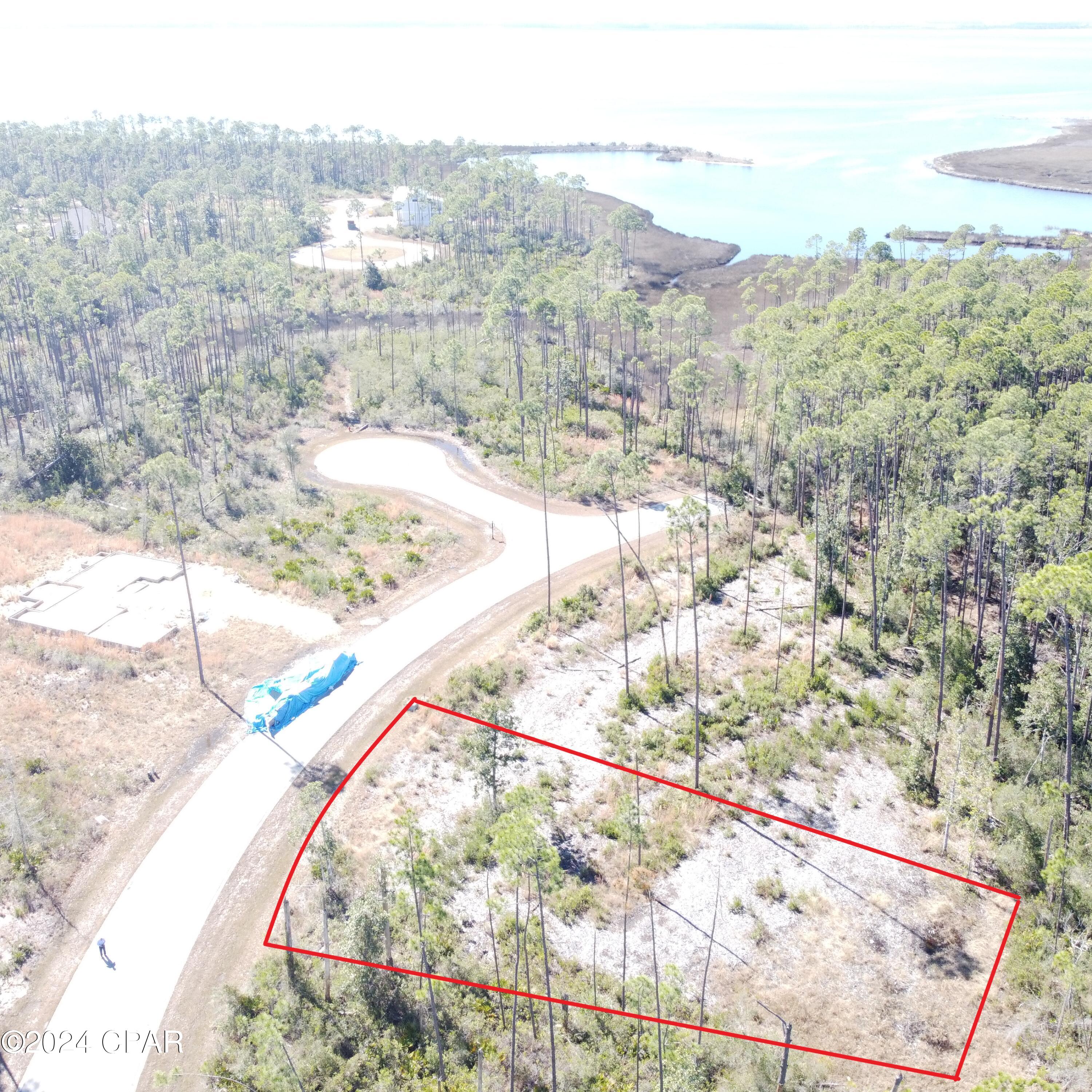 A Beautiful home site in the desirable Laird Point! This lot is located on the west side of the peninsula which is closest to East Bay. Enjoy amazing breezes off the water. Build 2 story and you may discover water views as well. Laird Point is a gated waterfront community boasting ribbon curbed streets and underground city utilities. Amenities include a tennis court and rv/boat storage. Beautiful coastal style homes throughout the community. No pre-set time to build, so you can lock in your spot now, and then build when you are ready. Great proximity to TAFB and Mexico Beach. Full service marina with boat launch just minutes away. Schedule your visit today!