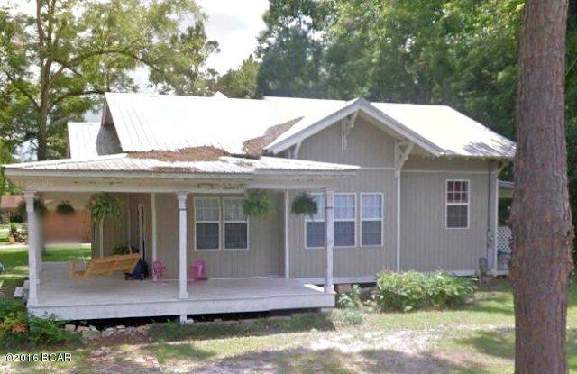 This home is move-in ready with traditional charm of the period including wrap-around porch, oversized bedrooms, 12 foot ceilings and hard wood floors. Many updates including metal roof, vinyl siding, new HVAC, refinished floors, kitchen cabinets/countertops and appliances. Bathroom has underwent a complete overhaul as well including new tile, whirlpool tub, double vanity and separate shower. House is located on corner lot in downtown Chipley, just minutes from schools, restaurants and shopping. House has had appraisal and 4 point inspection completed in December 2015.