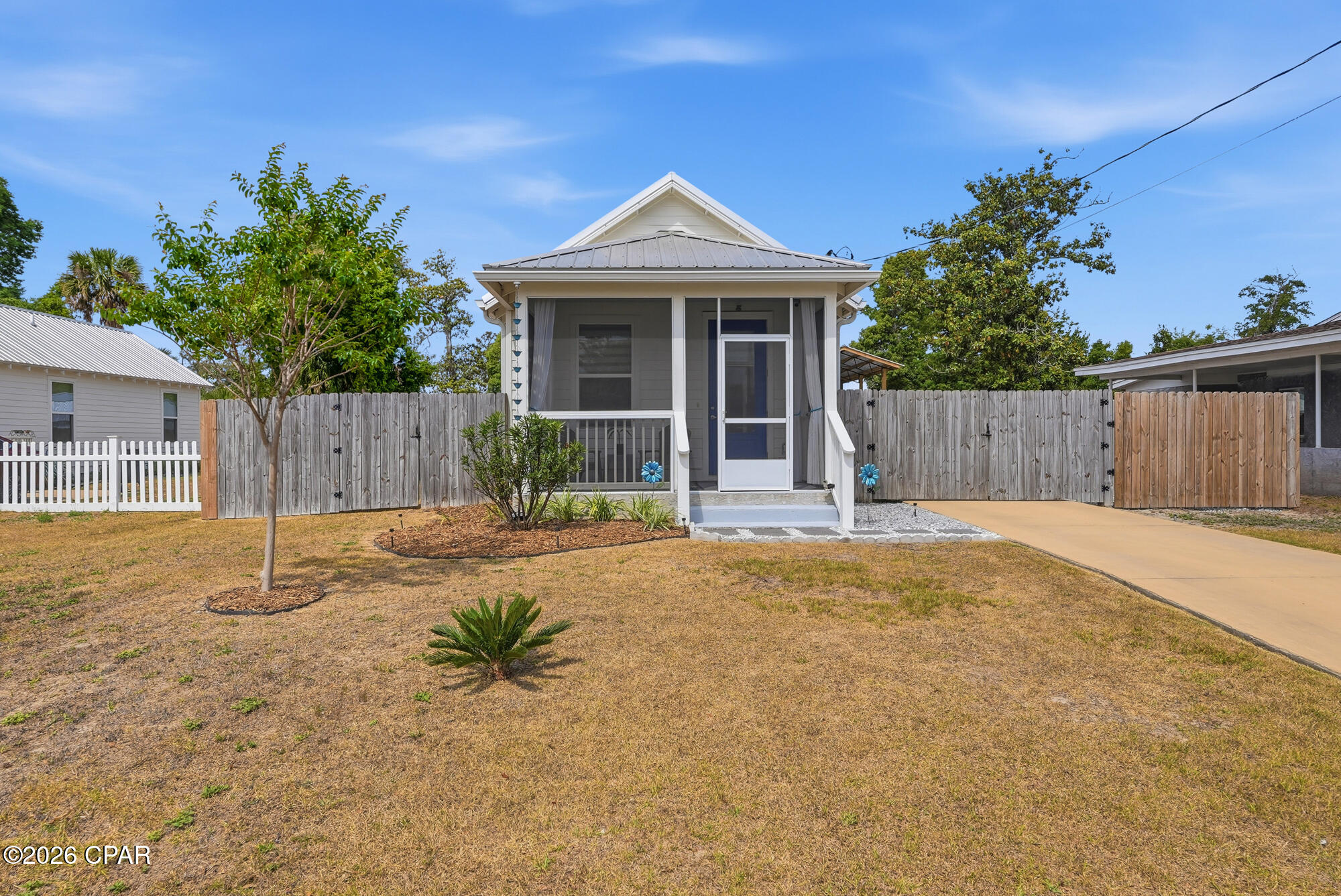 ***Price Drop and motivated sellers**
Welcome to a beautifully built 2021 home offering quality construction, thoughtful upgrades, and one of the largest buildable lots in the area--all just minutes from Downtown Panama City,  St. Andrews Bay and Ascension Sacred Heart Bay.  Flood zone X so no flood insurance required.  This easily could become a mini homestead freedom property, too!  NO HOA and free to add more!!!!!
From the moment you arrive, you'll appreciate the extra space, privacy, and ample off-street parking, perfect for boats, RVs, and entertaining. This gorgeous and well maintained home was built with durability and efficiency in mind, featuring 2x6 exterior framing, property line extends approximately 3 feet beyond the privacy fence
climate-controlled attic with AC, impact-resistant windows, blown cell foam insulation, and a metal roof--giving you peace of mind and long-term value.
Step inside to find LVP flooring throughout, 9-foot ceilings, and soaring cathedral ceilings reaching 13 feet in the primary bedroom, creating an open, airy feel. The kitchen is designed to impress with granite countertops, a granite  island, soft-close cabinetry, and a custom tile backsplash--perfect for everyday living and hosting.
Enjoy your mornings or evenings on the covered, screened-in front porch, or on your pool deck overlooking your expansive property. Stackable washer and dryer convey.  Since construction, the seller has added incredible upgrades:
12 x 44 x 14.5 RV pole barn with 30 & 50 amp hookups
12 x 22 carport attatched to pole barn
10 x 20 climate-controlled shed with 20 amp power & double lofts
24 ft wide / 54 inch deep above-ground saltwater pool with walk-in deck
Gravel/Sand stabilizer grids under pole barn/carport
Screened-in front porch
Privacy fence with 3 gates 
30 amp house hookup for portable generator
Expanded granite kitchen island and tile backsplash
Culligan water filter/softener 
Don't miss your chance to own a move-in-ready home with space to truly live the Gulf Life.  Buyer to verify all measurements and information.