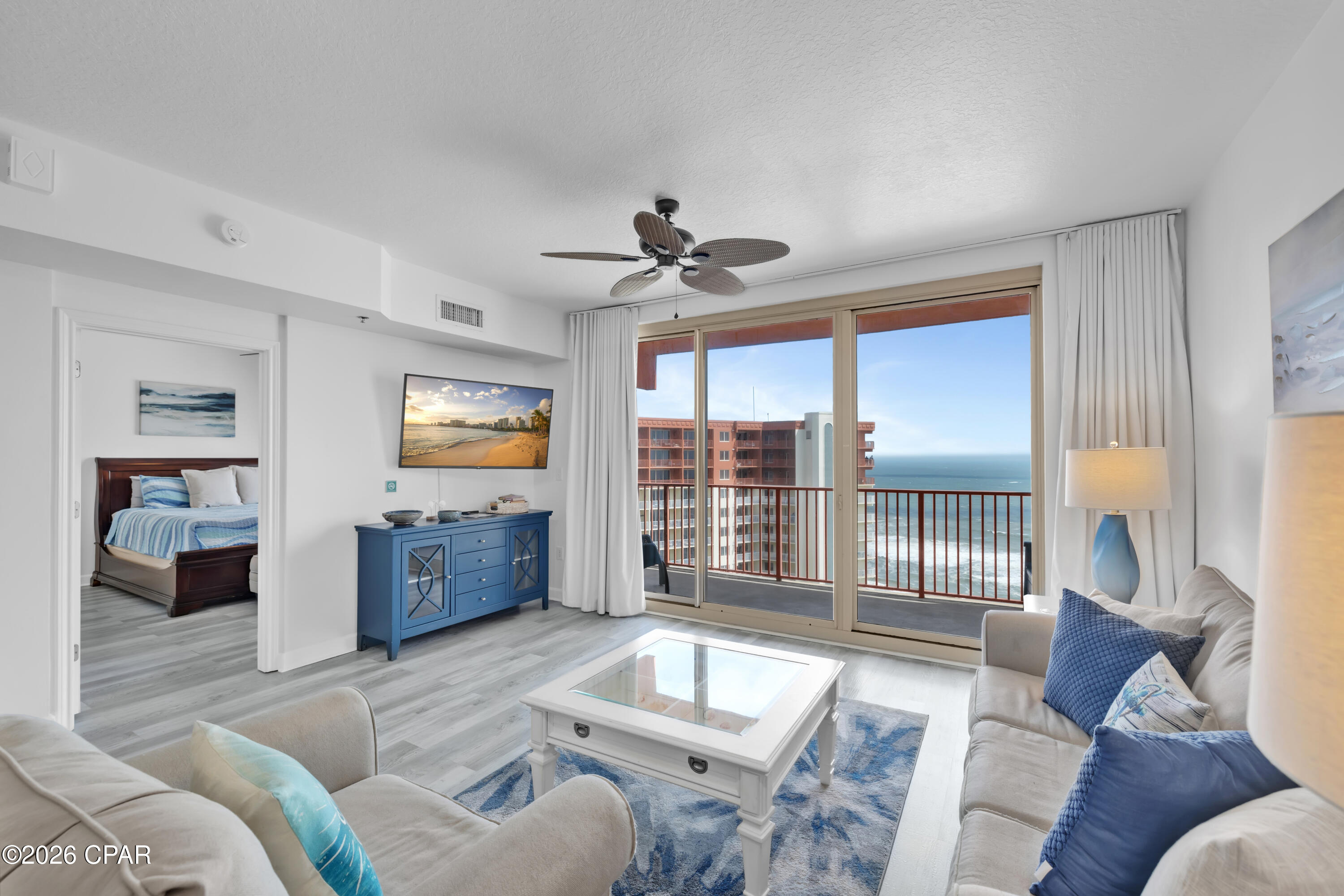 HIGH FLOOR. GULF-FRONT PRIMARY SUITE. 30-FOOT BALCONY. Shores of Panama 2213 is a furnished Type C floor plan on the 22nd floor of Shores of Panama Resort in Panama City Beach, Florida, featuring one bedroom, a private bunk room, two full bathrooms, and accommodations for up to six guests. The Gulf-front primary suite includes a king-size bed, Gulf views, a private ensuite bathroom, and a renovated vanity with a granite countertop, updated mirror, and updated lighting. A barn door provides separation and privacy for the bunk room, while the adjacent full bathroom includes a stackable washer and dryer and a dehumidifier.
The interior features luxury vinyl plank flooring throughout, coastal-inspired décor, updated light fixtures, flat-screen televisions, granite kitchen countertops, and abundant natural light. The oversized balcony extends more than 30 feet across the unit, providing elevated views of the Gulf, the resort's lagoon-style pool, and the surrounding coastline.
The property generated $36,171 in gross rental income during 2025. Gross rental income for 2026 totaled $24,330 through June, excluding July, with the current pace positioned to meet or exceed the prior year despite owner use. Rental figures are provided for reference only and are not a guarantee of future performance. The HVAC system was installed in 2017, and the water heater was installed in 2018.
This unit does not include a deeded parking space. Overflow parking is available throughout the resort parking garage, subject to resort rules and availability.
Shores of Panama Resort features a large Gulf-front lagoon-style pool with zero-entry access, palm-lined islands, fountains, and a spacious hot tub. Additional amenities include resort-exclusive beachfront access, an indoor heated pool and hot tub, a 24-hour fitness center, a seasonal poolside Tiki bar, covered parking, complimentary Wi-Fi, and on-site security. Pineapple Willy's is adjacent to the resort, while Laketown Wharf across the street offers dining, retail, and entertainment options. Additional Panama City Beach attractions include Pirates Voyage Dinner & Show, Topgolf, McGuire's Irish Pub, and Tootsie's Orchid Lounge.
Quarterly HOA dues are currently $3,491.71. All information, measurements, rental figures, availability, and HOA fees are deemed reliable but not guaranteed; buyer to verify if important.
