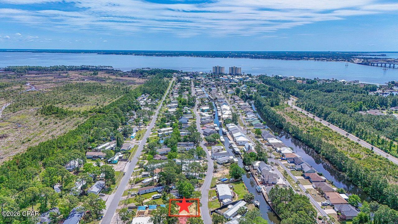 Affordable coastal living in Panama City Beach! Why break the bank when you can enjoy the Gulf Coast lifestyle at a fraction of the cost? This vacant lot in Bayside Park allows mobile homes and offers a great opportunity for a weekend getaway, primary residence, or short- or long-term rental property.

Boating and fishing enthusiasts will love being near Bayside Marina, a newly renovated full-service marina offering valet storage, rentals, and an in-house mechanic. Just minutes by boat from the Gulf, you can be at the island or on your favorite snapper fishing hole by sunrise.

The seller has already brought in fill dirt, making this lot ready for your new home. Best of all -- NO HOA!