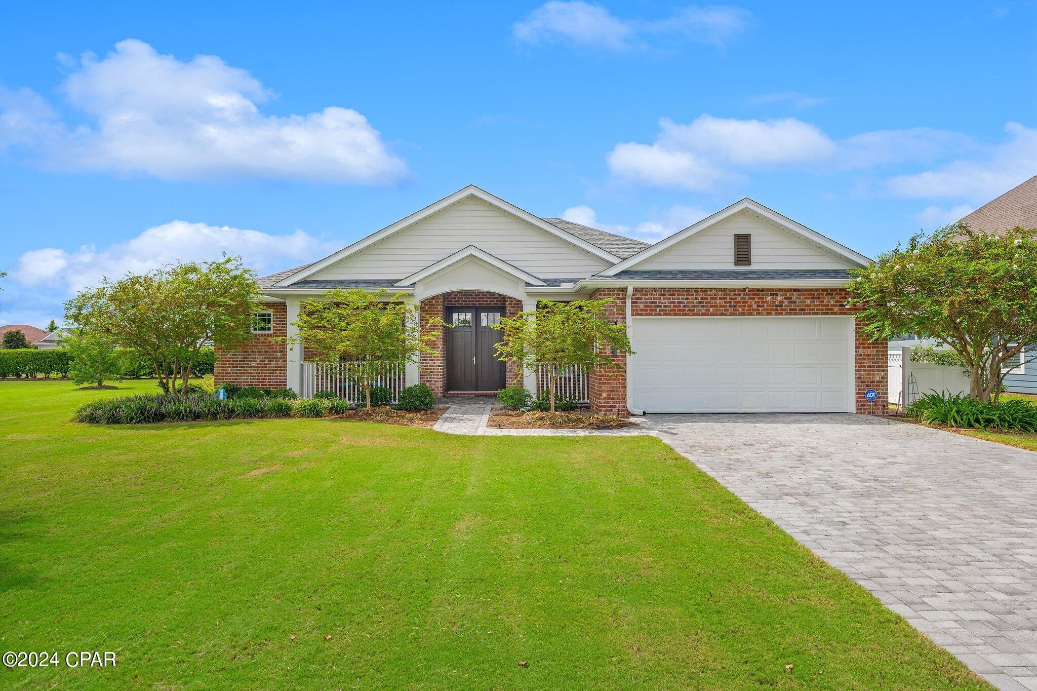 Welcome to 128 Martingale Loop, a stunning Arthur Rutenberg home located in the highly sought-after Plantation at College Point neighborhood in Lynn Haven, FL. This above-average quality, all-brick residence boasts three bedrooms, an office, and an array of features that make it the perfect blend of luxury and comfort.

As you approach the property, you'll be captivated by the meticulously maintained landscaping and expansive yard, setting the tone for the elegance within. Step inside to discover rich hardwood flooring that flows throughout the open floor plan, creating a warm and inviting atmosphere. The spacious living room, bathed in natural light from an abundance of windows and three large sliding glass doors, seamlessly opens to the screened porch—ideal for entertaining or simply enjoying the serene Florida weather.

The gourmet kitchen is a chef's dream, featuring a central island, a coffee bar, sleek stainless steel appliances, and a gas stove—perfect for preparing meals with ease. The outdoor space is just as impressive, with a landscaped back yard and a cozy fire pit, making it perfect for hosting gatherings or relaxing under the stars.

Retreat to the generously sized master suite, complete with a tray ceiling and a luxurious master bath featuring a separate shower, garden tub, water closet, and a spacious walk-in closet. The additional bedrooms are well-appointed and offer plenty of space for family or guests.

There is a two-car garage, water purification system, automatic sprinkler system, Generac generator , extra insulation for energy efficiency and an Arlo wireless security system in addition to an ADT system with door and window sensors

The Plantation at College Point community offers amenities such as a playground and scenic walking throughout the College Point neighborhood, providing a peaceful and friendly environment. Plus, you're just a short distance from North Bay, public parks, and boat ramps, offering endless opportunities for outdoor activities.

Don't miss the chance to own this exceptional home in a prime location. Schedule your private showing today and experience the lifestyle that 128 Martingale Loop has to offer!