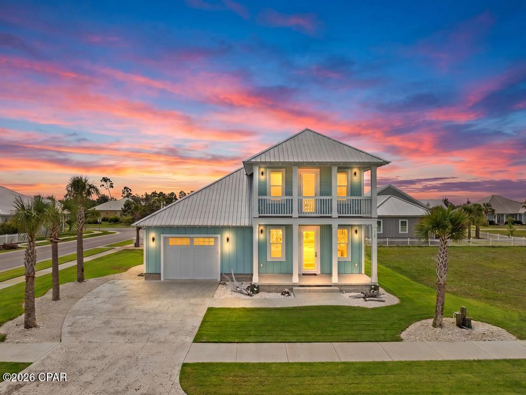 Welcome to 112 St. Frances Street, a 3BR/3.5BA custom-built home in Mexico Beach's Casuna subdivision, sitting on a corner lot just two blocks from the beach and a one-minute golf cart ride away. Built in 2023, this home is framed with 2x6s instead of the standard 2x4s, features a metal roof, spray foam insulation throughout the attic and above the garage, impact-resistant doors and windows, and an insulated garage door with Ring flood cameras for added security. The kitchen features custom cabinetry, KitchenAid appliances, granite countertops, and hidden outlets for a clean, modern look. The first-floor master suite offers a massive 7x15 walk-in closet complete with an 8-foot mirror in the pocket door, while both upstairs bedrooms are spacious and each have their own private bathroom with quartz countertops. The attached garage is already wired for a mini split and features a heat pump water heater that keeps the space comfortable even in the peak of summer. Out back, a covered patio with an outdoor kitchen setup is perfect for entertaining, and the community pool and clubhouse are just a short walk away. With a low $900 annual HOA, a gulf view from the balcony, and golf cart-friendly surroundings, this home is a great find in Mexico Beach. Call today!