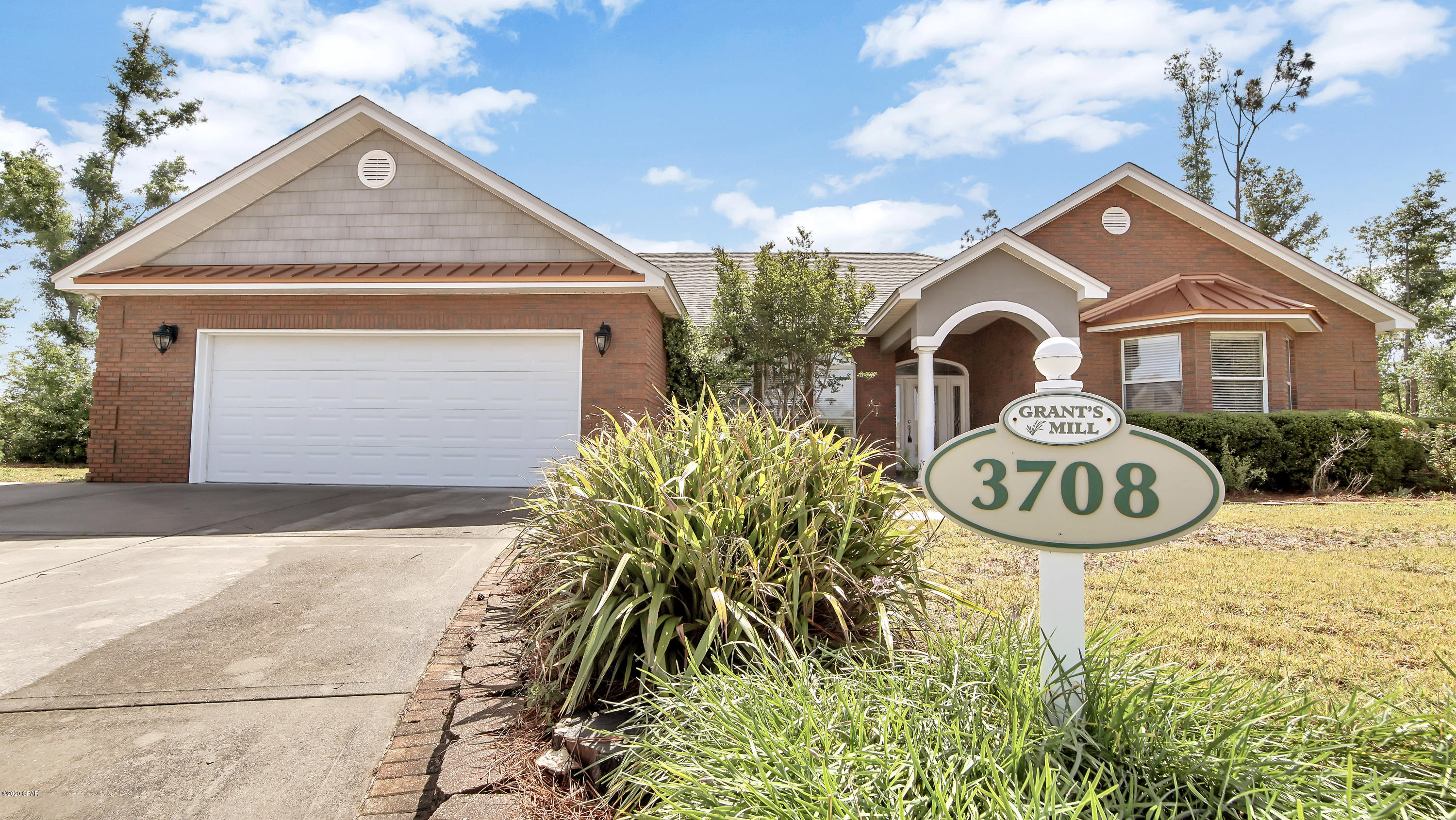 Beautiful home in the prestigious Grants Mill neighborhood! Priced to sell!  This gorgeous, all brick home sits on a huge lot & boasts a great open floor plan. As you walk in you'll immediately notice the amazing formal dining room, giant living room & brick fire place. You'll love the breakfast bar, island, & many cabinets the kitchen has to offer! The split bedrooms offer privacy & comfort for the whole family. The master bedroom is very large & has a bathroom w/jetted tub & separate tile shower fit for a king! The other three bedrooms are great size including one with a beautiful bay window. Come enjoy the mornings in the FL room overlooking the large back yard. There's even a nice shed to store your garden tools. This home is a must see!