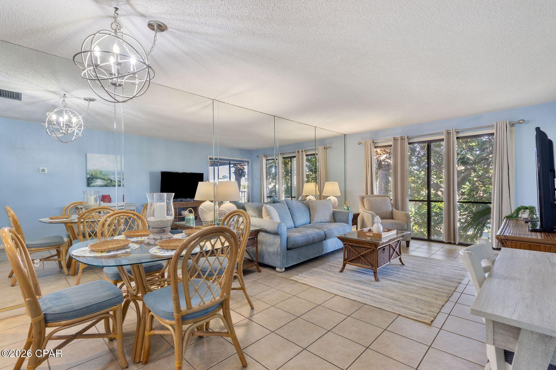 Set on the second floor and shaded by a sweeping magnolia, this fully furnished one-bedroom villa offers a calm coastal rhythm, open golf-course views, and a thoughtful layout designed for easy living and effortless getaways. Positioned within the gated grounds of Edgewater Beach Resort, the residence balances privacy with access to one of the area's most amenity-rich resort environments. Glass sliding doors in both the living area and bedroom open to a private balcony overlooking the course, creating a seamless indoor-outdoor connection and a sense of space rarely found in a one-bedroom offering. Inside, tile floors run throughout, and the kitchen has been refreshed with new appliances and fresh paint. The primary suite is generously sized with its own bath This condo is offered turnkey and fully furnished, making it equally well-suited for personal use or rental. A short walk or quick shuttle ride leads to the beach and main pool complex, while several additional pools are located nearby for quieter afternoons closer to home. Residents enjoy an expansive lineup of resort amenities, including a beachfront restaurant with room service, multiple heated pools and outdoor hot tubs, a fitness center, spa and salon services, tennis and pickleball courts, shuffleboard, a par-3 executive golf course, on-site dining and market options and a full calendar of activities hosted at the conference center. The homeowners' association covers nearly all expenses, including water, cable, internet, trash, golf, and resort amenities, leaving only electric as a separate utility. Located in Panama City Beach, the villa places shopping, dining, recreation, and coastal adventure close at hand while maintaining a relaxed setting framed by green space and mature landscaping. This is a low-maintenance coastal retreat that pairs comfort, convenience, and resort living in one inviting address.