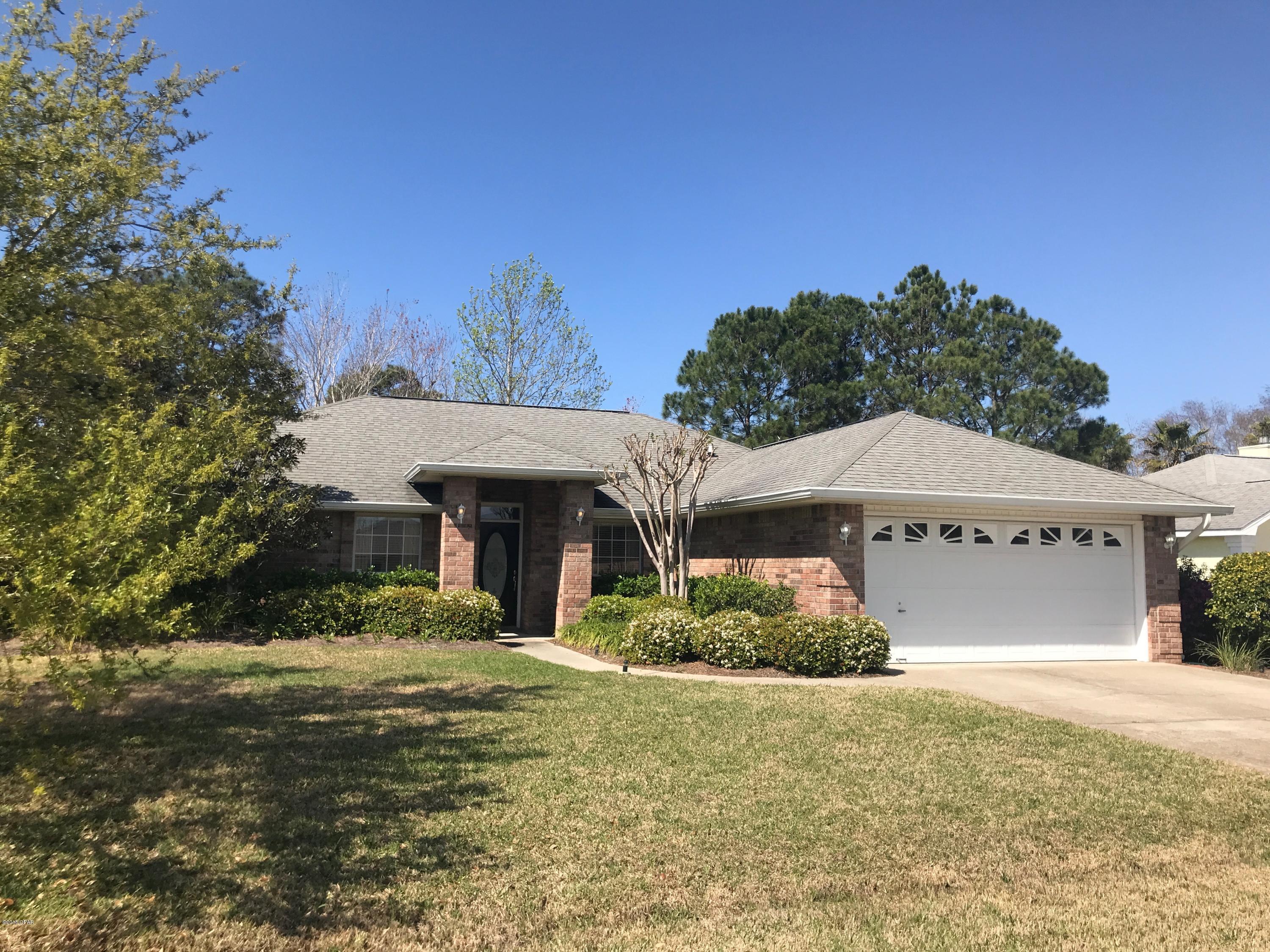 You will LOVE this beautiful home.  This home has been lovingly cared for by owner and has many upgrades such as beautiful wood floors, updated kitchen with granite countertops and lots of storage!  This split floor plan offers his and hers walk in closets, as well as vanities in the master bathroom.  There is also a library/office and a formal dining area in this open floor plan.  Owner has left outdoor furnishings and a Chiminea & HOT TUB for your enjoyment! Lawn care is included at this price.  Home is 5 min to Navy Base and beaches, location on east end of PCB.