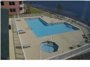 Beautiful view of Bay from the back Balcony. Pool, tennis courts & fitness room. Cultured marble vanities and a whirlpool bath. Kitchen has granite counter tops. This is a must see. Water/Sewer/Garbage and basic cable included. This unit is in Tower One closest to gate.
