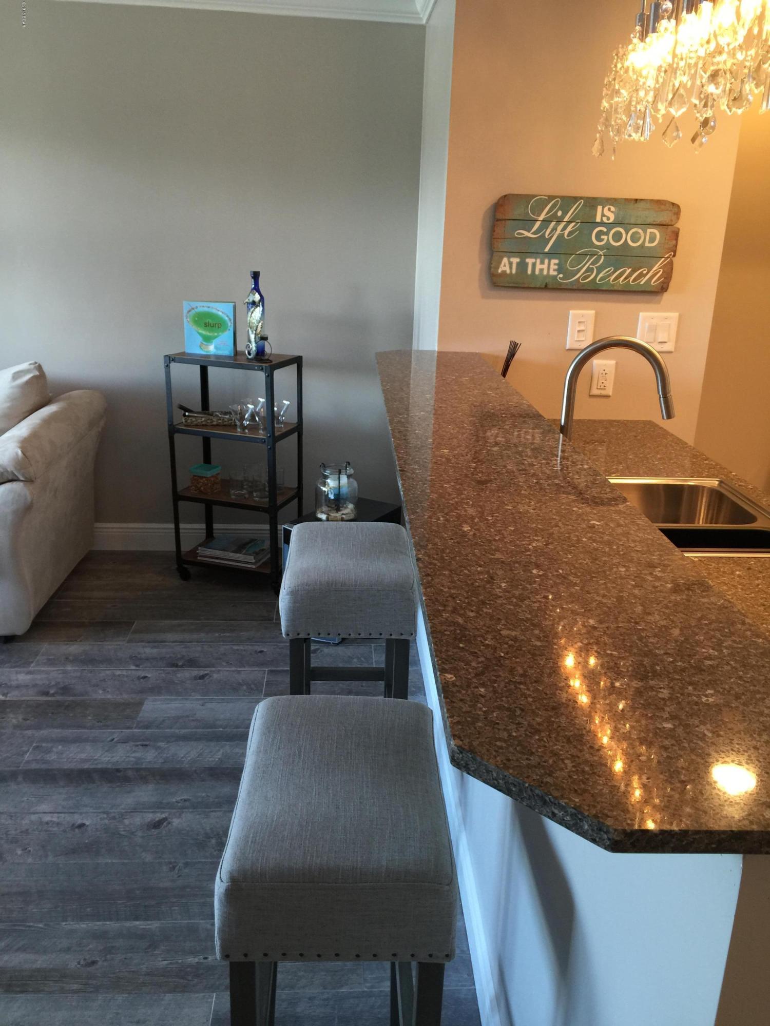 This is the one you've been hoping to find. Remodeled with boat slip, storage room, and walk right across Thomas Drive to the beach!

Penthouse inspired with the finest of everything, the photos can't say enough about how lucky you will be to own this one! Furnished down to the dishes!