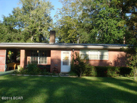 GREAT HOME AND GREAT PRICE for this quaint and spacious two bedroom/one bath home located in Chipley City Limits of a well established neighborhood. The home is conveniently located to shopping, schools, restaurants, and a local park. Upon entering this home you will find a very large living room with a brick fireplace. The laundry area is near the back door entrance. The flooring is vinyl and carpeting. The kitchen has a small island and lots of cabinet space. The oversize bathroom has a nice sized vanity and the bedrooms are quite large with generous closet space. There is a covered patio for your relaxing days, afternoons,or evenings. The front and back yards are very pretty, with partial privacy fencing in the backyard. There are fruit bearing citrus trees and very nice shrubbery in the backyard. There is also a shed that has electricity that could be used for storage for your gardening tools or used as a workshop. The metal roof and central heat and air are less than ten years old. This home would make a great investment property, or even a great home for downsizing or a first time home buyer. This one won't last long for it really is a lovely and pleasant home that has been well maintained. Call for an appointment today!
