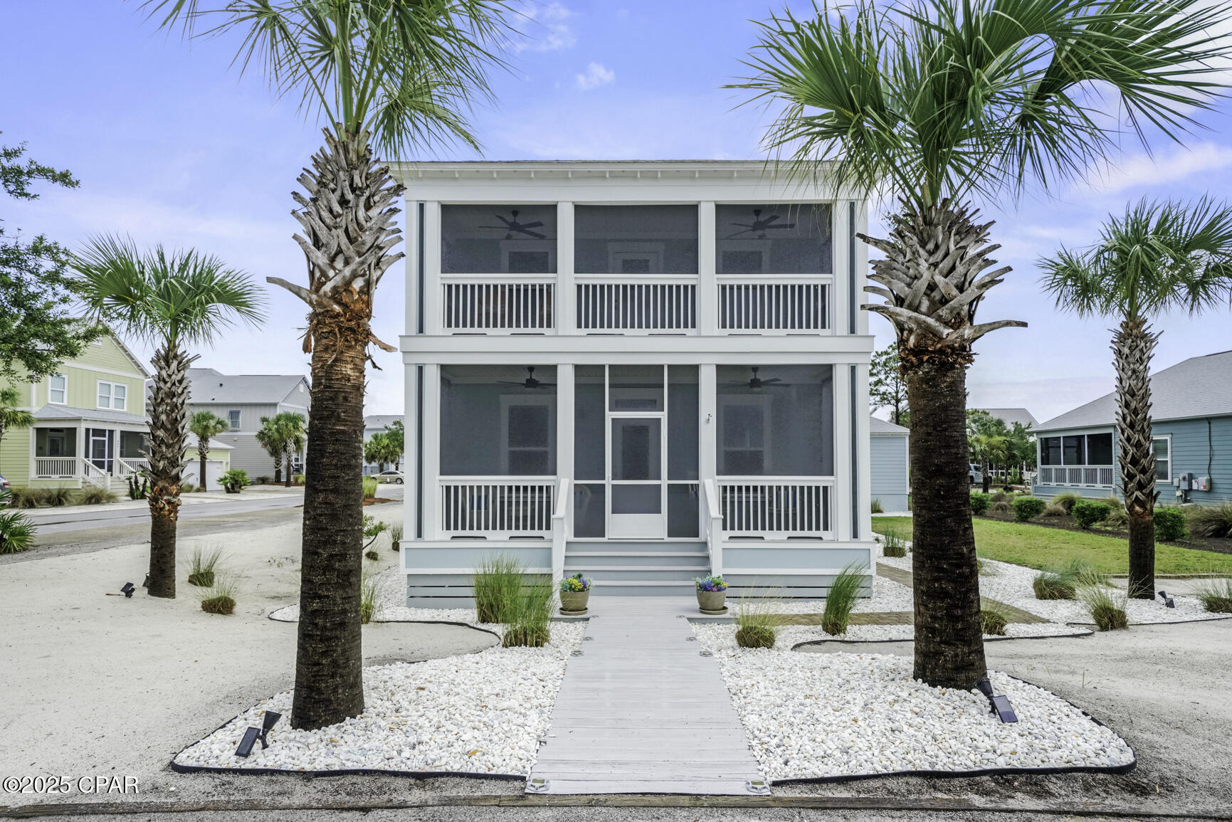 Coastal charm meets casual elegance in a prime location just steps from the beach in the beautiful Windmark beach community!  Polished from top to bottom, this 3BR/2.5BA beach house is situated on an oversized corner lot in one of Port St. Joe's most sought-after communities.  The open-concept layout shines with brand-new porcelain tile and baseboards throughout, designer lighting, new ceiling fans, custom iridescent glass pantry doors, and updated hardware on every door.  The chef's kitchen features a new gas stove, and all bathrooms have been tastefully updated with new vanities, faucets, lighting, and lavatory upgrades. The master bath includes a newly tiled walk-in shower for a spa-like retreat.  This home is being sold stylishly furnished—completely turnkey.  Freshly painted inside and out in a soft coastal palette, the home features all-new exterior ceiling fans, new screens on all three porches, and low-maintenance Bahama rock landscaping that enhances curb appeal and functionality.  Designed for effortless coastal living, the large lot includes an outdoor shower, a detached garage perfect for your golf cart or beach toys, and ample space for a future pool or addition. Enjoy your morning coffee on the screened porch, take in Gulf and Bay views from every floor, and spend your evenings grilling on the brick patio. With easy beach access just steps away, you're perfectly positioned for paddleboarding, fishing at sunrise, or gathering around a bonfire on the sand.  Located in Windmark's Beachside Village, you're just a quick golf cart ride from waterfront dining, boutique shopping, a gym, spa, wine bar, and more. Community amenities include two resort-style pool, clubhouse, walking trails, pet-friendly boardwalks, and deeded beach access. Whether you're seeking a high-performing short-term rental, a dream vacation home, or a full-time coastal retreat, this one checks every box.     Don't miss your chance to own a piece of paradise and live the beach life!