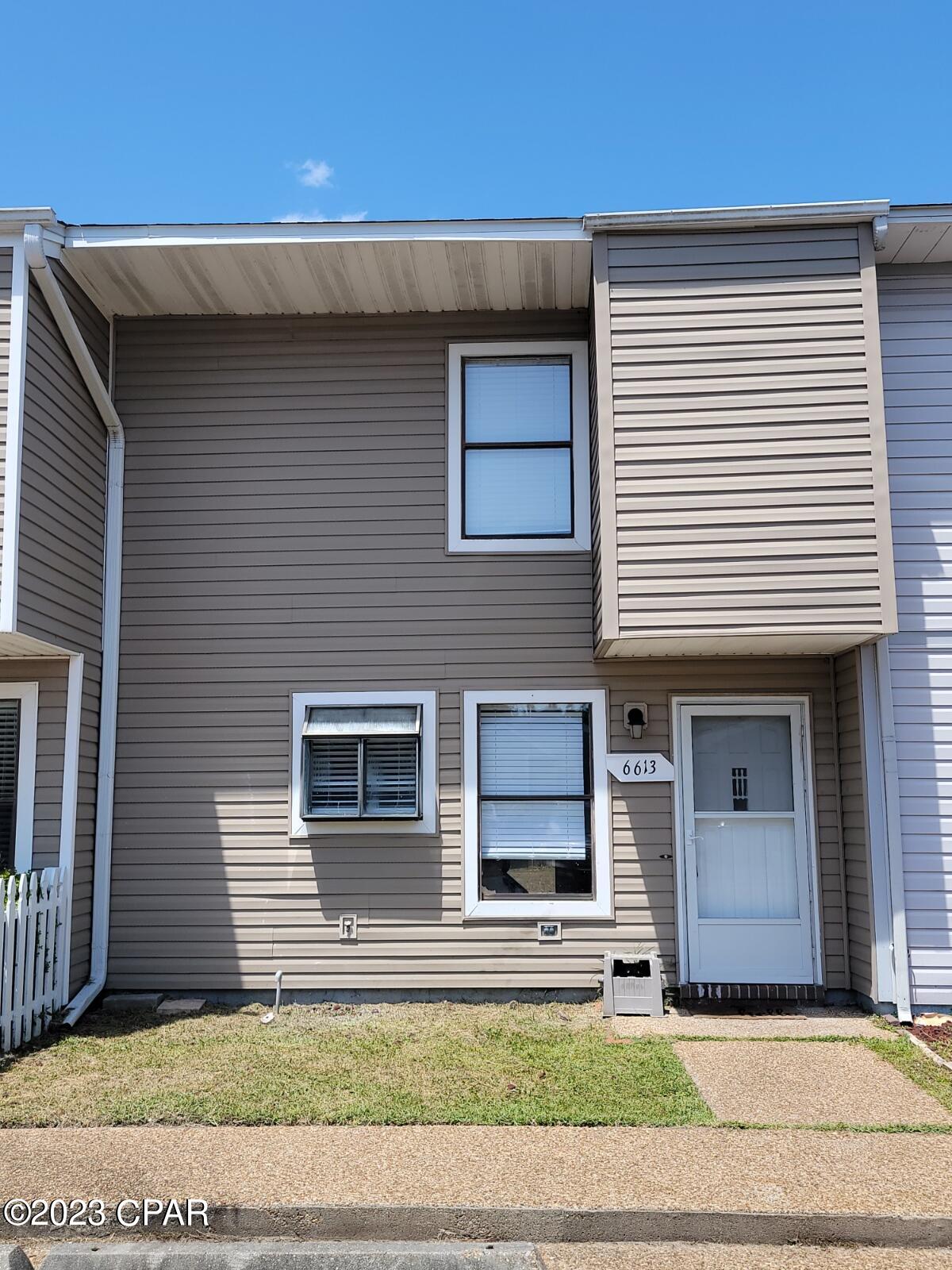 CURRENTLY UNDER CONTRACT, SELLER WILL CONSIDER BACKUP OFFERS'.   Lovely 2 bedroom. 1.5 bath townhome.  Fresh paint & new carpet & plank flooring.  Kitchen has been updated cabinetry, and is equipped with refrigerator, range, dishwasher, and microwave.  Master bedroom is spacious and has two closets. The roof and AC system were replaced in 2018. Small privacy fenced backyard. Convenient to Tyndall Air Force Base as well as shopping, restaurants, and schools. Would make a great starter home or investment opportunity.
