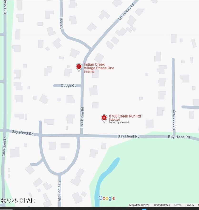 All sizes are appx///Corner building lot in ''INDIAN CREEK VILLAGE''  situated on small creek that empties into Deer Point Lake--which is not navigable!!! Two (2) boat landing to lake are within one mile--neighborhood is restricted to single family homes with paved streets and apx 60 homes--great area for Tyndall families with lots of yard for kids to play and enjoy the activities on Beautiful Deer point Lake!!  Fishing, Boating, Swimming, skiing etc .