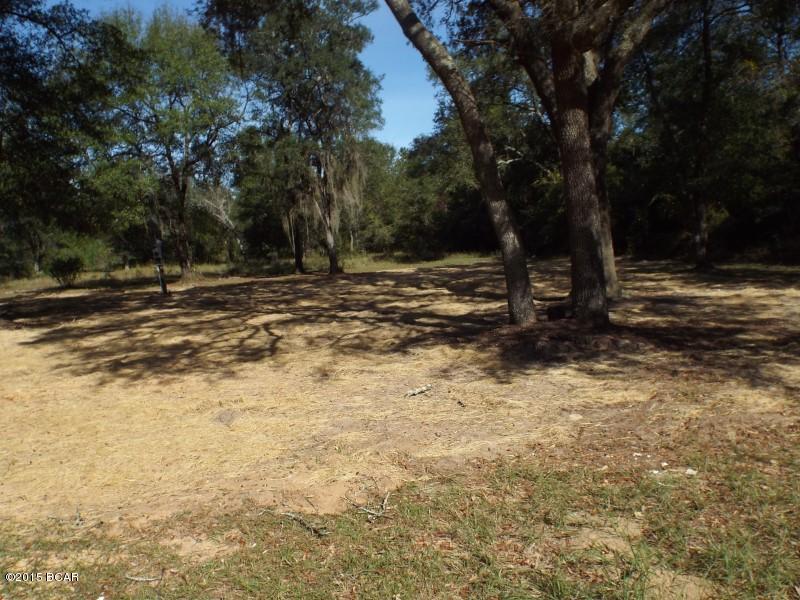 2.6 acres with old well an septic sold as is.