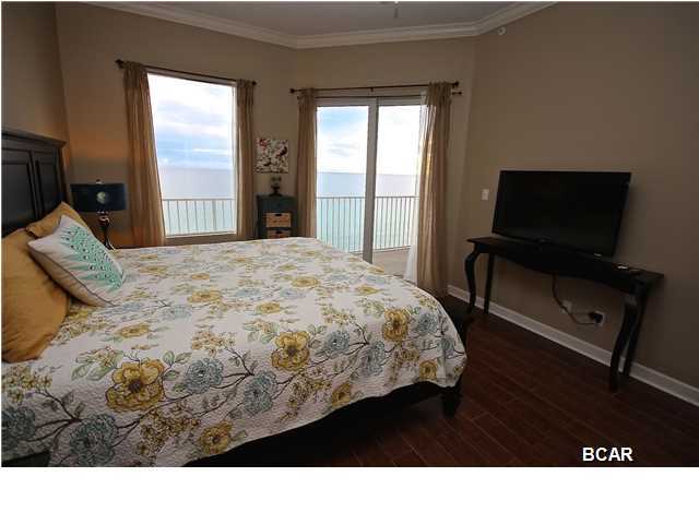 Imagine waking up every morning in your large ocean front master bedroom opening on to your full length balcony. Gaze upward and admire your condos raised ceilings with crown molding. Enjoy the exquisite matching tile found throughout this 3 BR masterpiece. Granite countertops, modern appliances, a full size washer & dryer and a huge master bathroom await you in this Emerald Coast gem. Amenities include private parking, pool, fitness center, and more. Own your piece of paradise directly on the finest beach in Florida.
