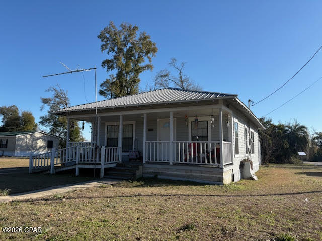 2 rental investment properties for the investor looking to increase their real estate portfolio or perfect for those looking to downsize. Easy to manage, you can Rent one and Live in One.  These rentals are located in a quiet small-town setting, approximately one hour from Panama City, the beaches, Pier Park, and Northwest Florida Beaches International Airport. Centrally located with convenient access to the new Calhoun Liberty Hospital in Blountstown, Walmart and Lowe's in Marianna, and just a short drive to the Chipola River boat ramp for boating and fishing. The 2/1 1055 sf house is at a Corner lot location, and the 2019 3/2 1176 SF Single Wide Mobile home is surrounded by a thick tree line for added privacy, featuring a cozy covered deck at the back--perfect for relaxing in the outdoors. Total monthly rental income from both homes is $1,725. The house rents for $800 and the SW MH rents for $925